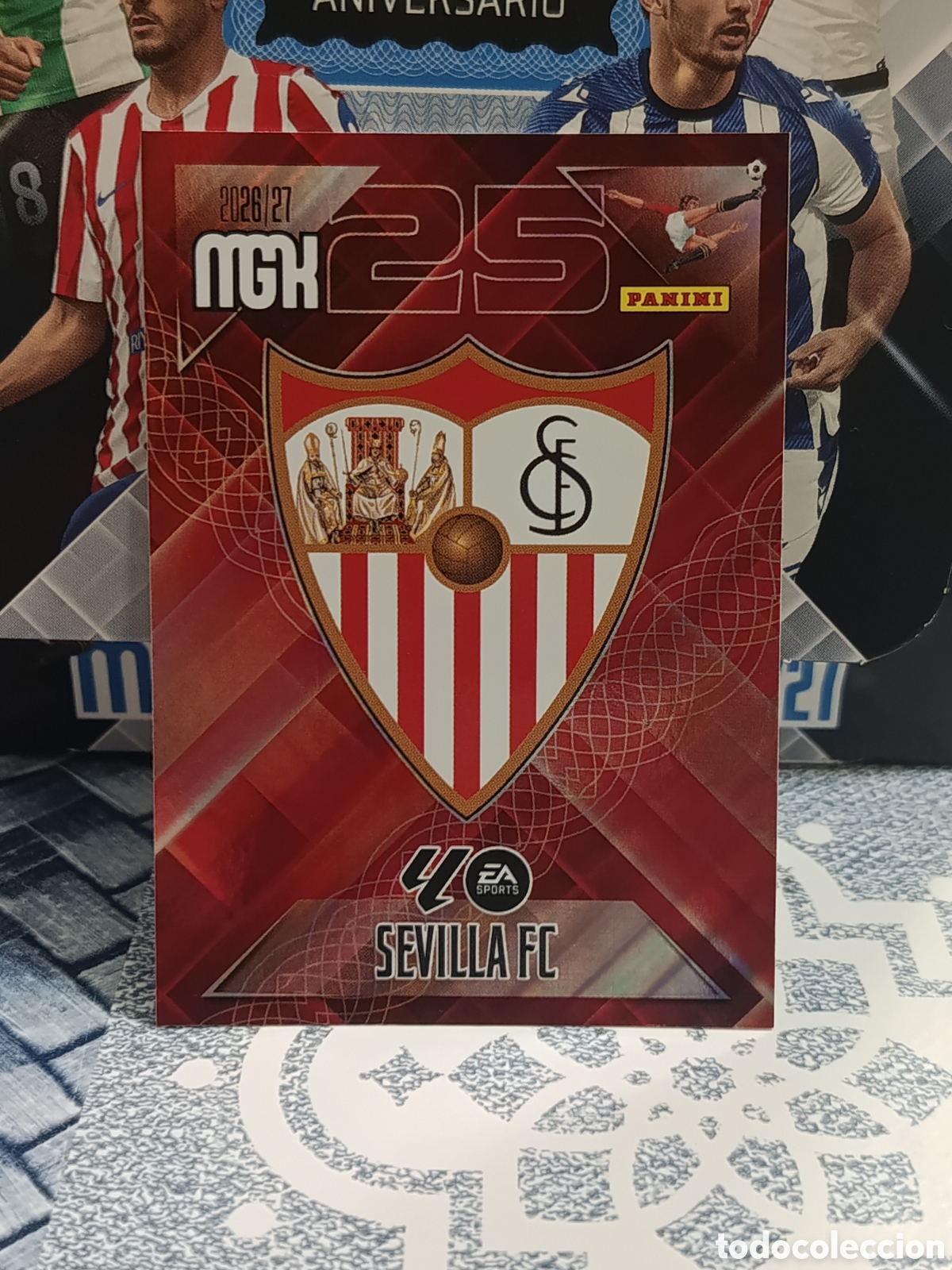 Coleccionismo cromos antiguos: ESCUDO SEVILLA N&ordm; 325 MGK 26 27 2026 2027 PANINI