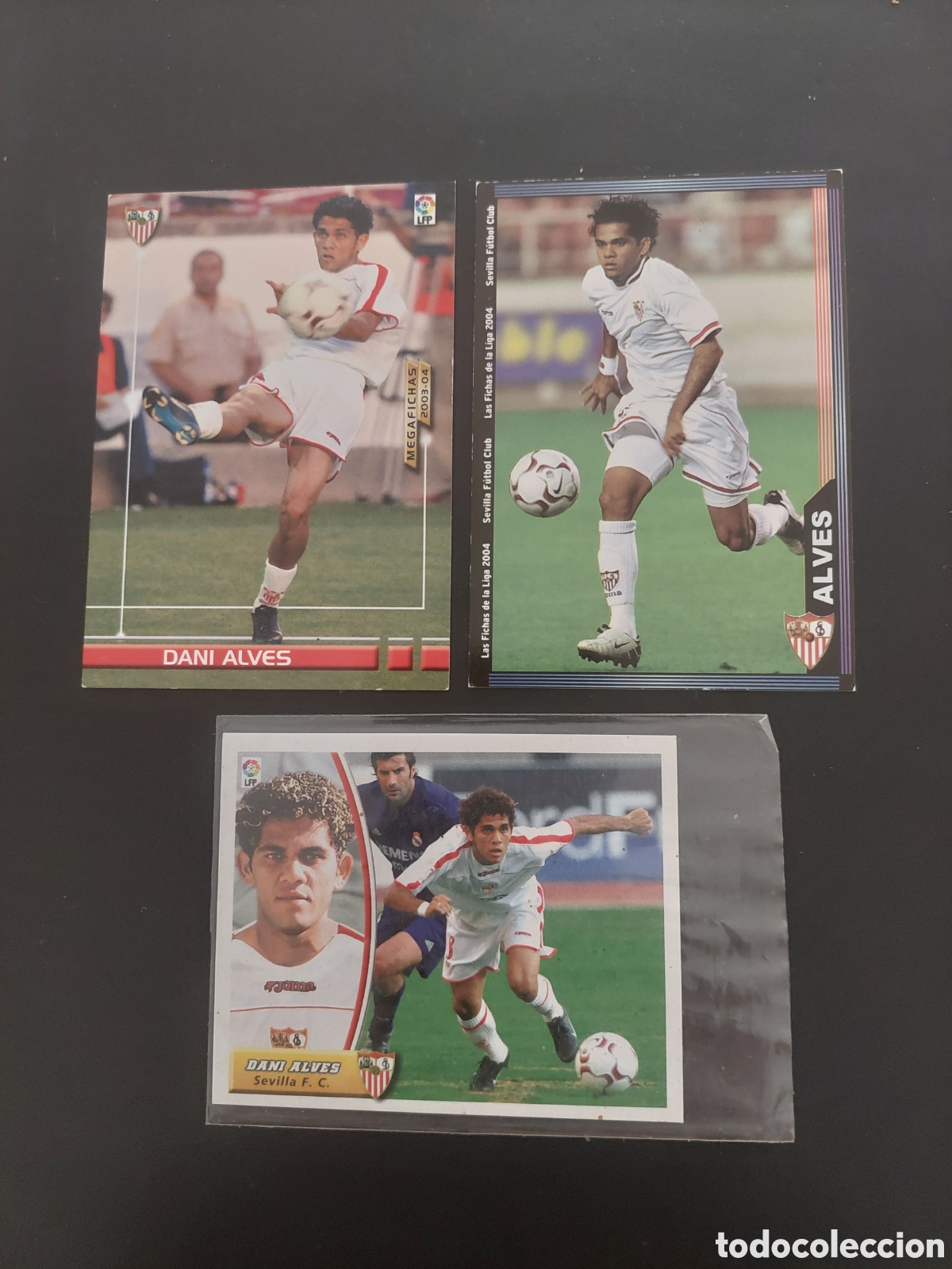 Cromos de F&uacute;tbol: DANI ALVES Rookie 03 04 Las tres Colecciones MegaFichas, Mundicromo y Liga Este