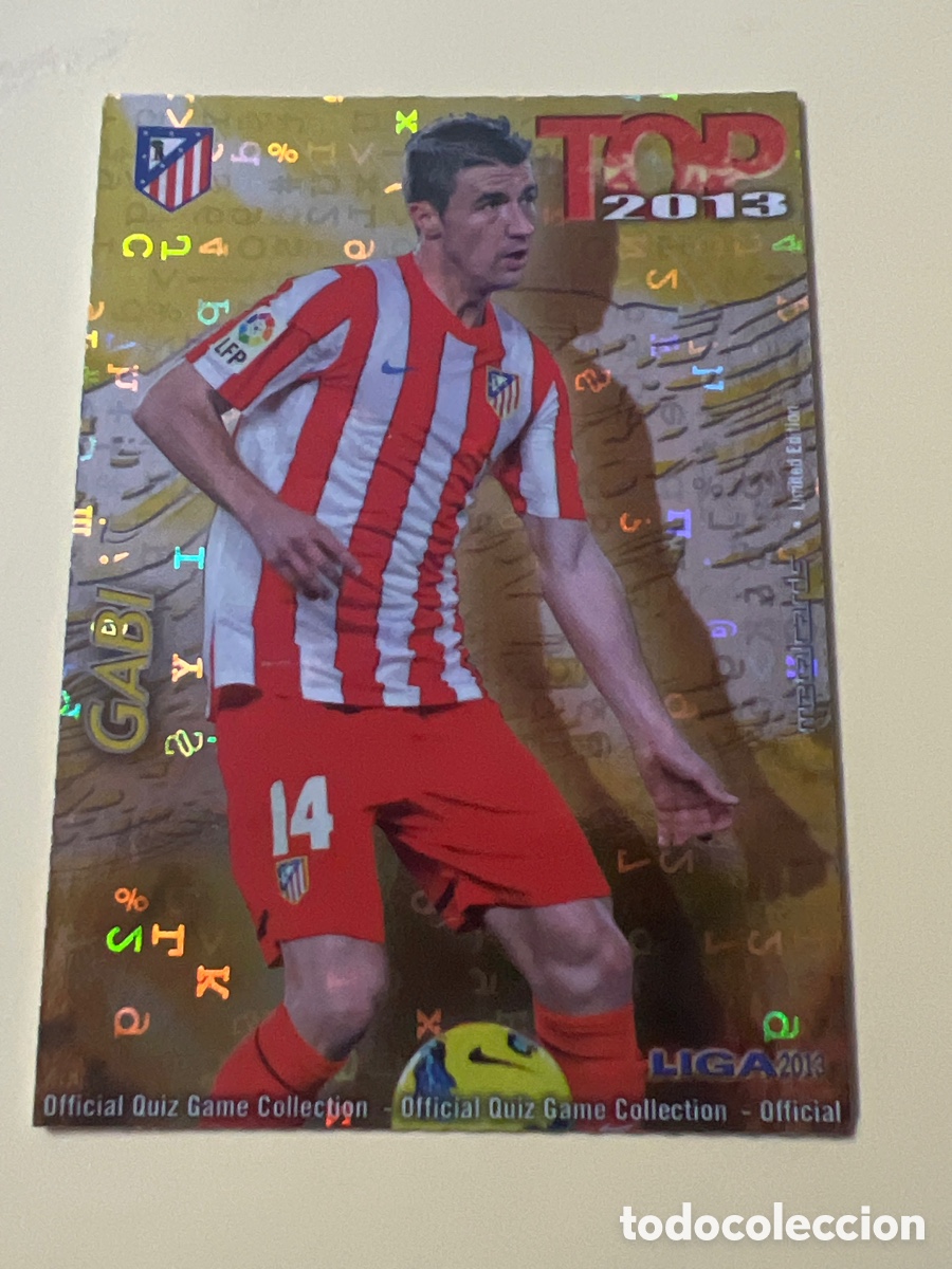 Cromos de F&uacute;tbol: E911. 590 GABI (ATLETICO DE MADRID) TOP BRILLO AMARILLO LETRAS - MUNDICROMO 2012 2013 LIGA 12 13