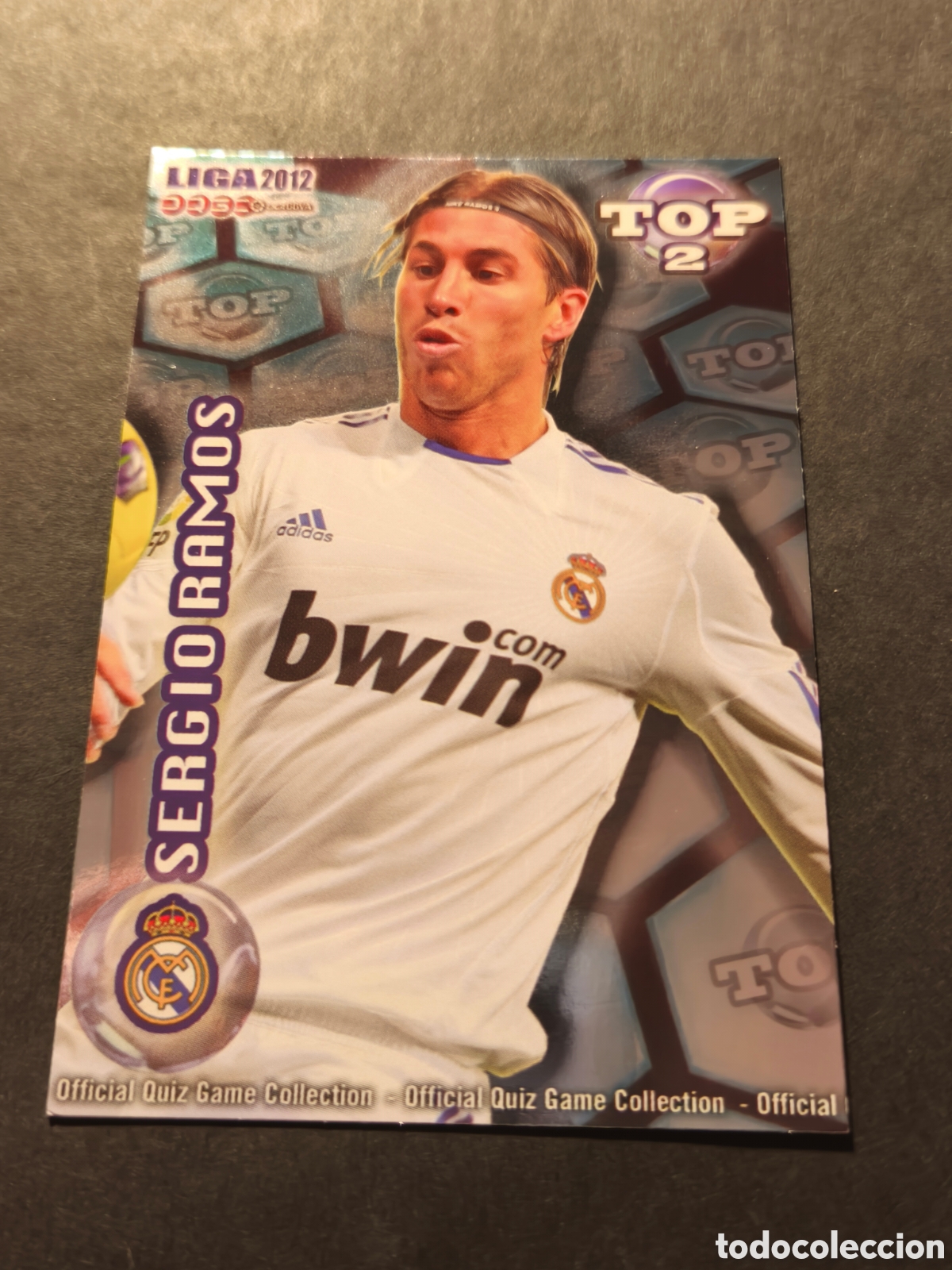 Cromos de F&uacute;tbol: 551 SERGIO RAMOS REAL MADRID MUNDICROMO 2012 TOP2 VERSION FONDO AZUL BRILLO