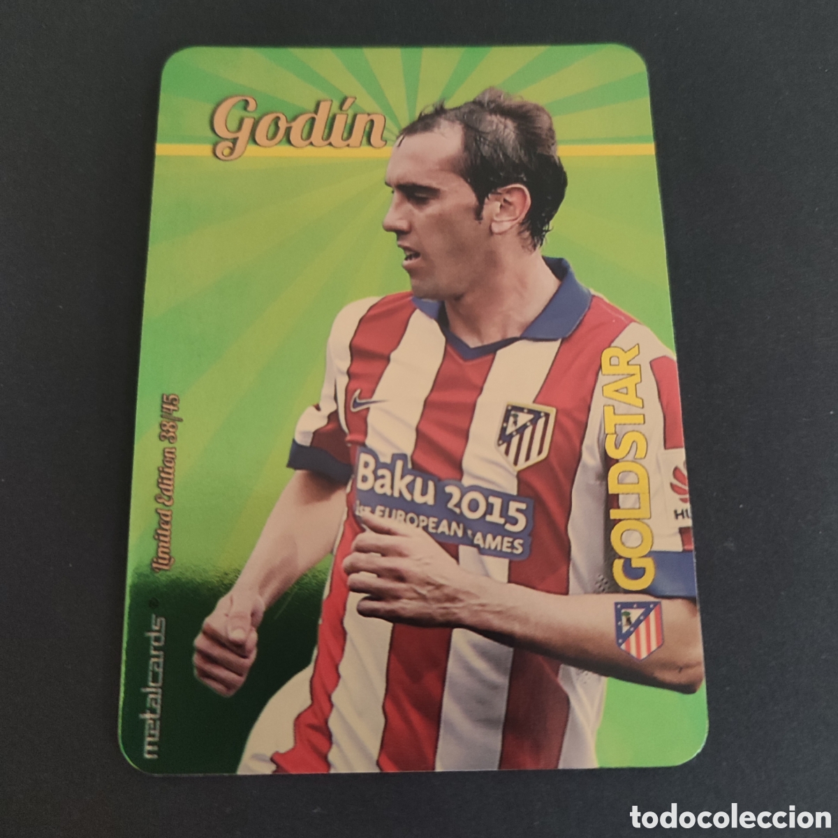 Cromos de F&uacute;tbol: GODIN (ATLETICO DE MADRID) GOLDSTAR BRILLO LISO DORADO , LIMITED EDITION 38/45 MUNDICROMO 2015 2016