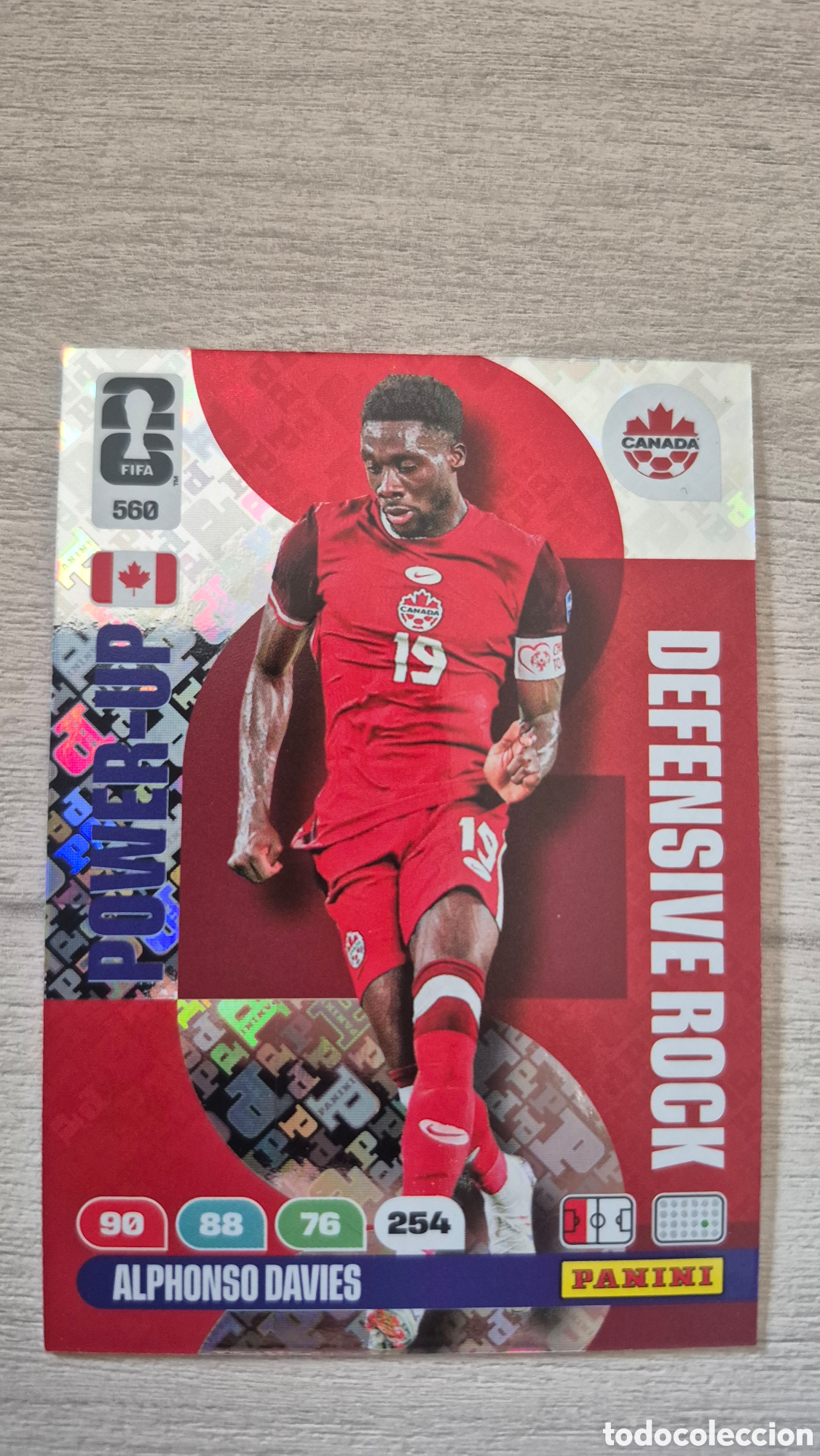 Cromos de f&uacute;tbol: N&deg;560 Power-Up Defensive Rock Alphonso Davies Adrenalyn FIFA World Cup 2026