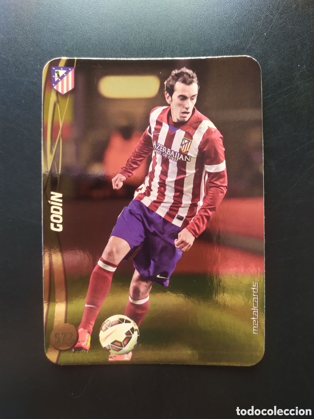Figurine di Calcio: Mundicromo fichas Liga 2014 2015 14 15 Godin top brillo liso dorado n&deg; 573 Atl&eacute;tico Madrid
