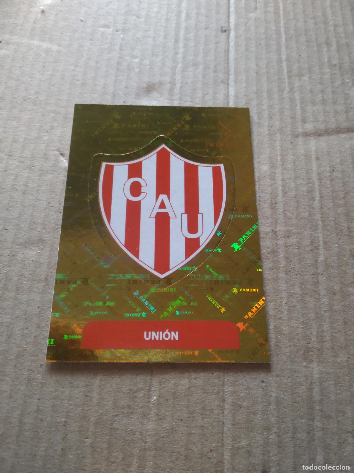 Cromos de F&uacute;tbol: UNI1 ESCUDO UNION CROMO FUTBOL ARGENTINO PANINI LIGA ARGENTINA 2025