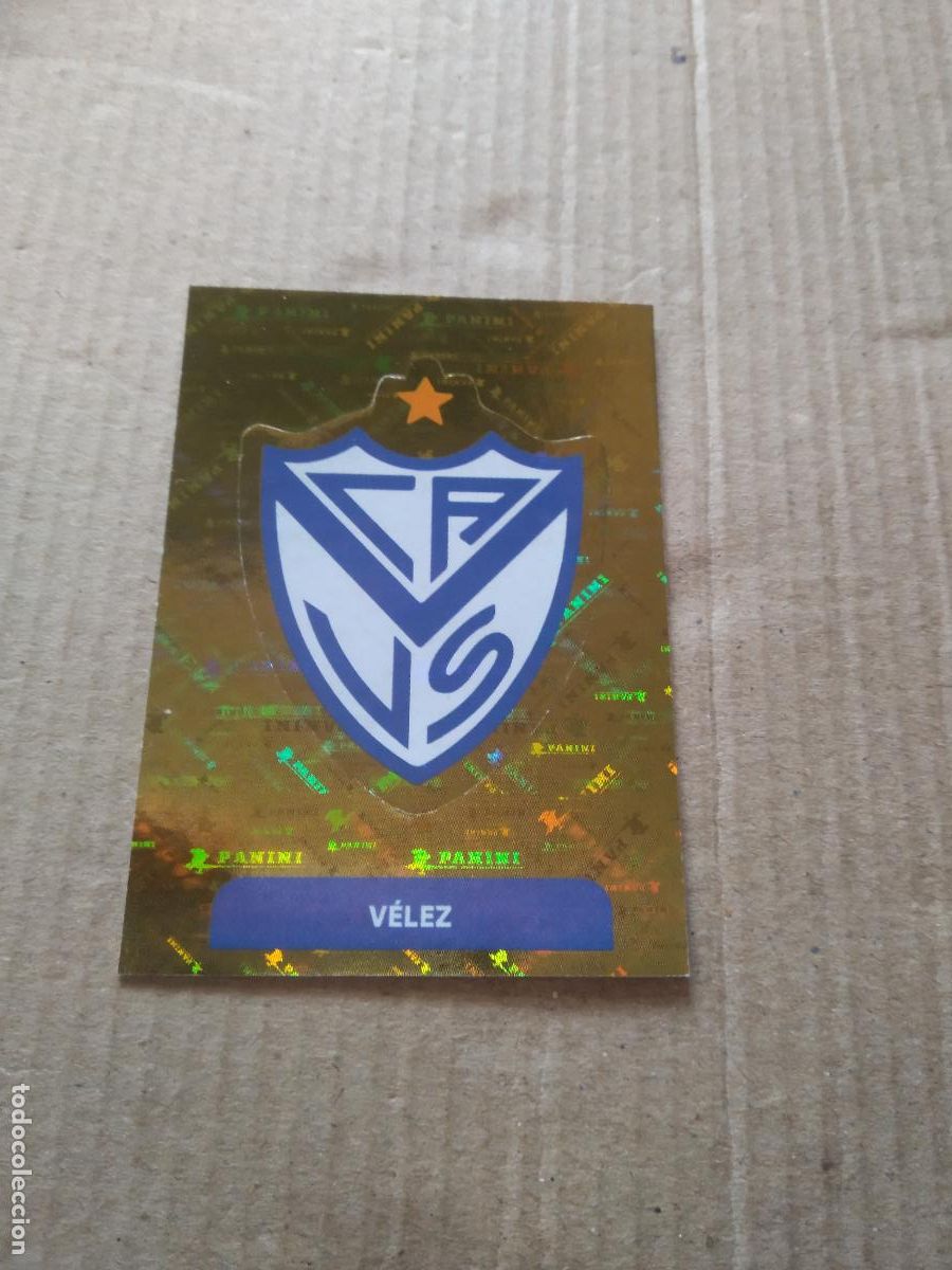 Cromos de F&uacute;tbol: VEL 1 ESCUDO VELEZ CROMO FUTBOL ARGENTINO PANINI LIGA ARGENTINA 2025