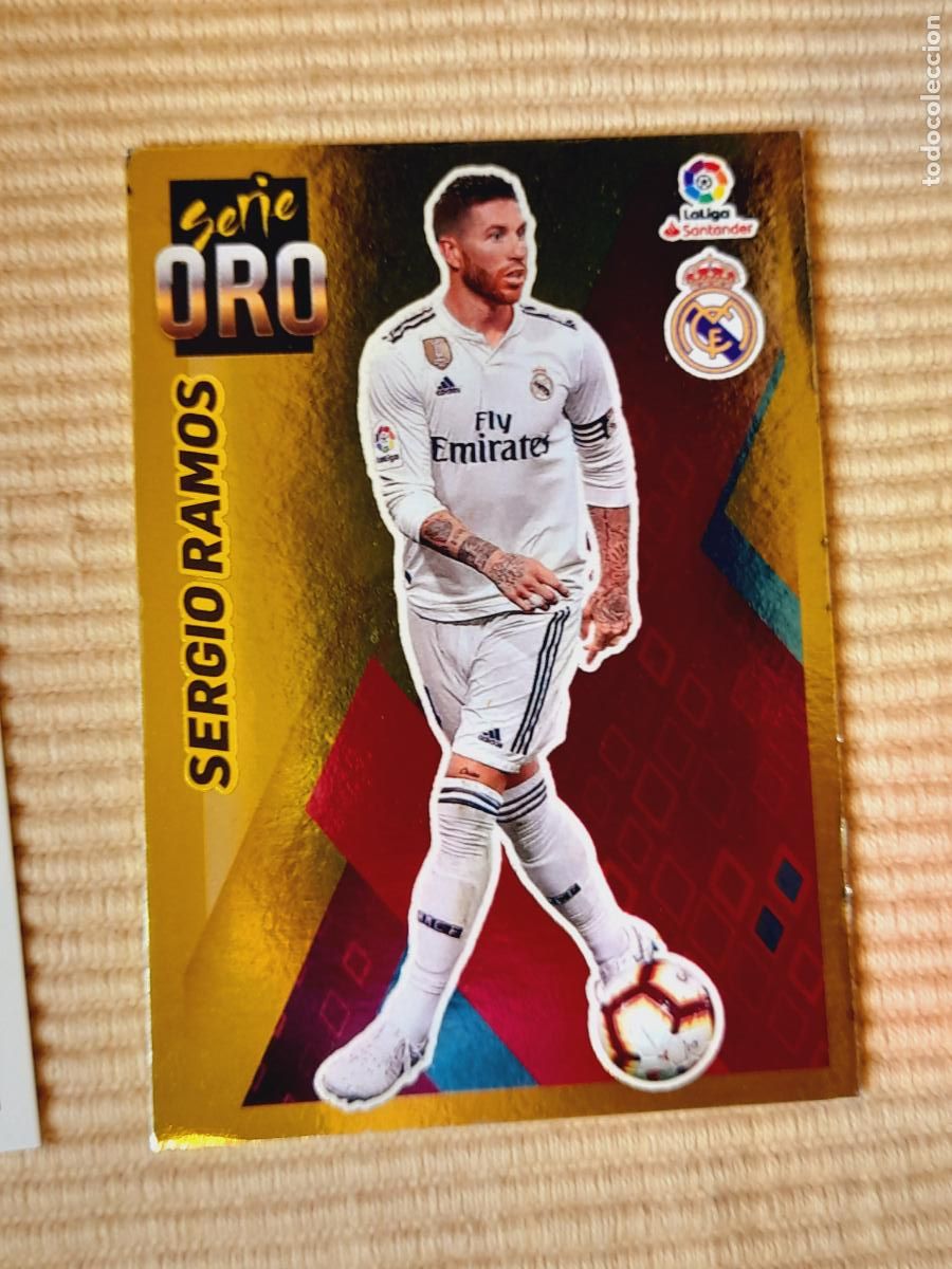 Cromos de Futebol: CROMO 13 SERGIO RAMOS (SERIE ORO) REAL MADRID LIGA 19-20 (2019 2020) &Aacute;LBUM ESTE