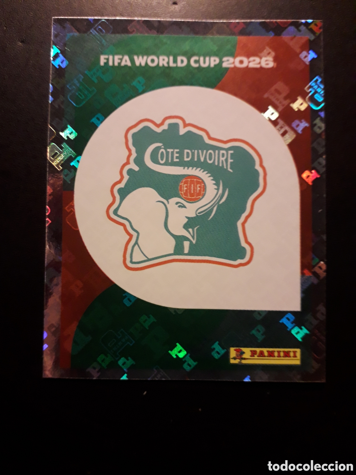 Cromos de F&uacute;tbol: ESCUDO COSTA DE MARFIL CIV 1 MUNDIAL F&Uacute;TBOL 2026 FIFA WORLD CUP PANINI SIN PEGAR PEDIDO M&Iacute;NIMO 3&euro;