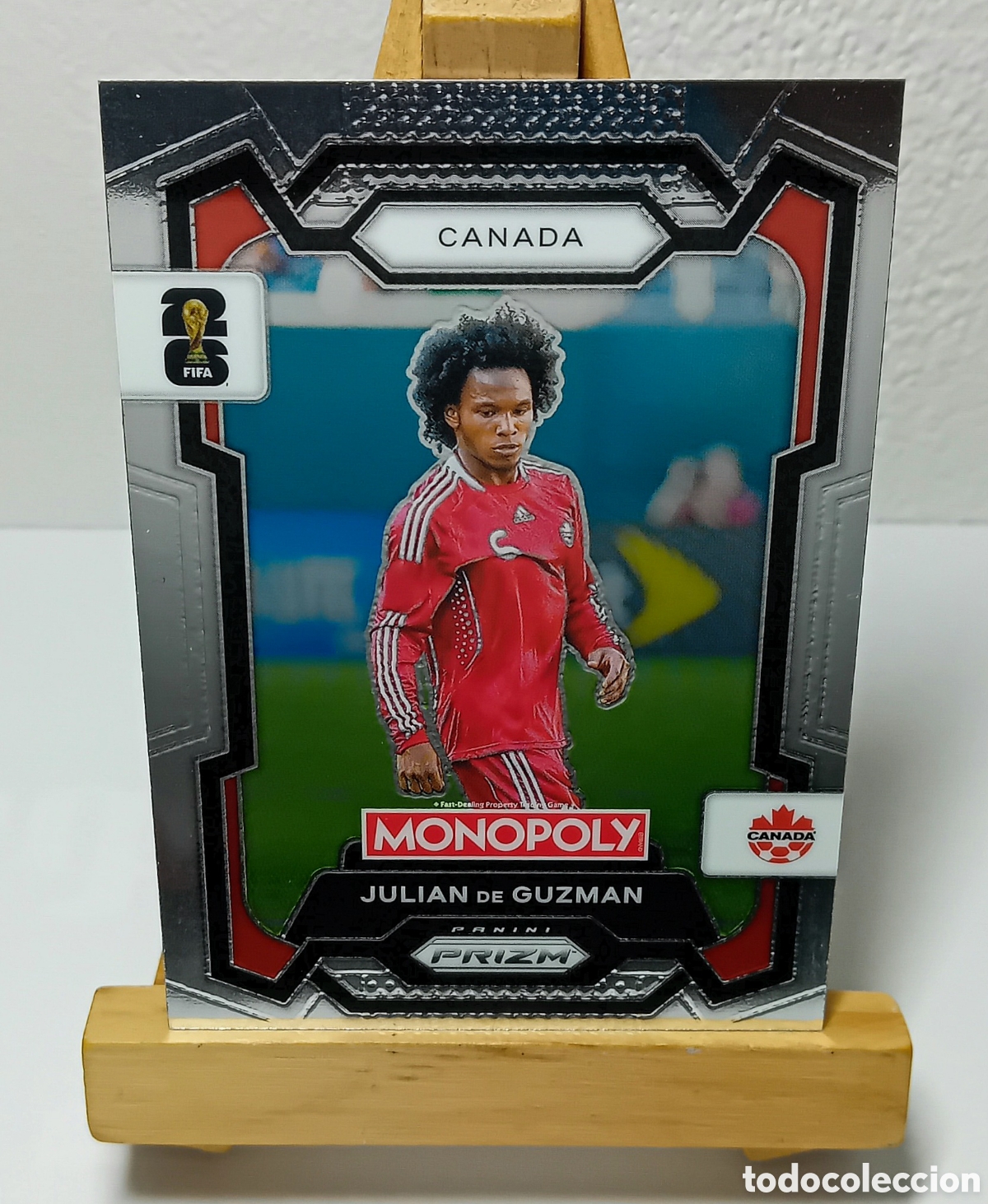 Fu&szlig;ball-Sticker: JULIAN DE GUZMAN 2026 CANAD&Aacute; MONOPOLY PRIZM PANINI N&deg;77.
