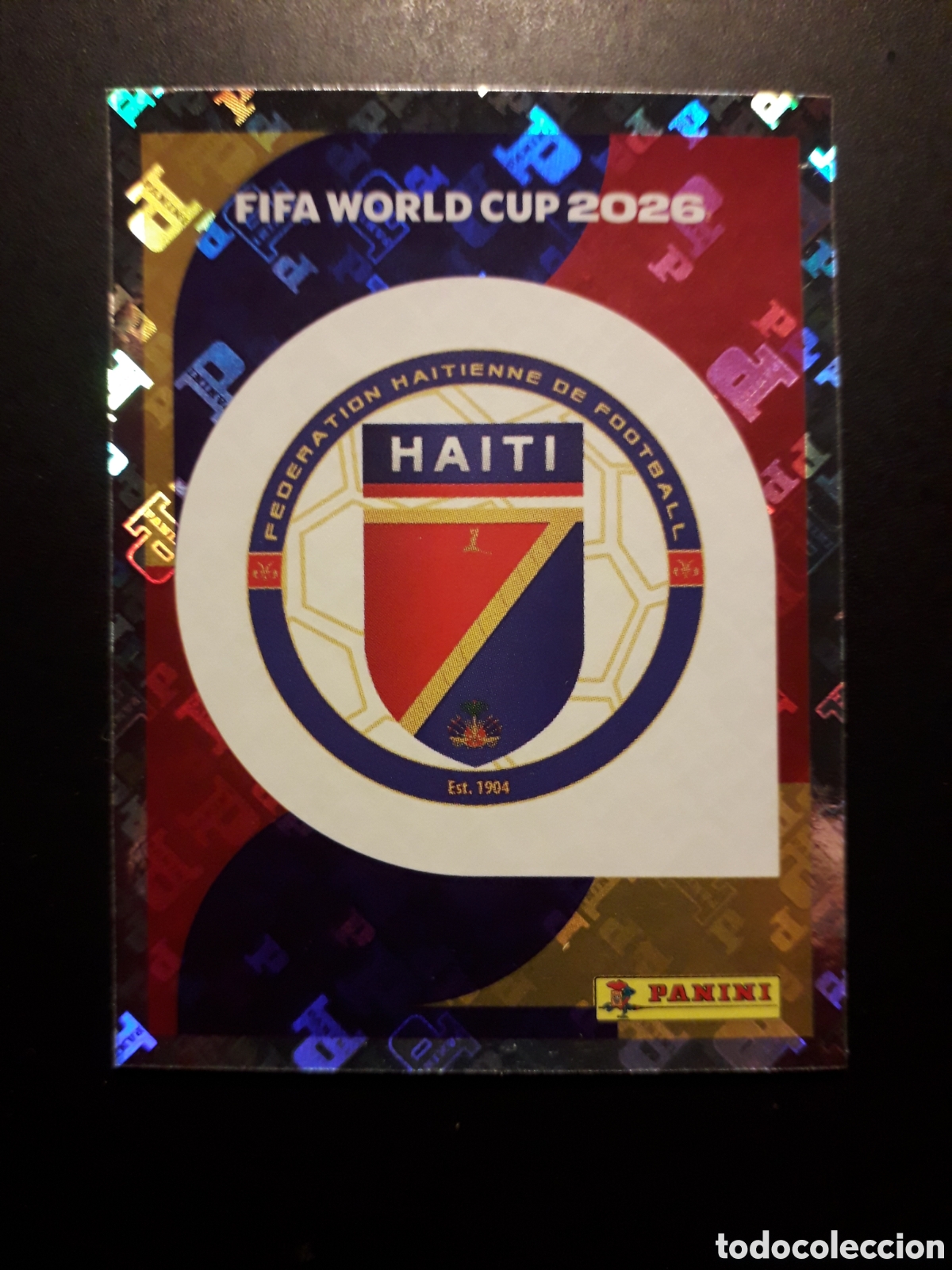 Cromos de F&uacute;tbol: ESCUDO HAIT&Iacute; HAI 1 MUNDIAL F&Uacute;TBOL 2026 FIFA WORLD CUP PANINI SIN PEGAR PEDIDO M&Iacute;NIMO 3&euro;