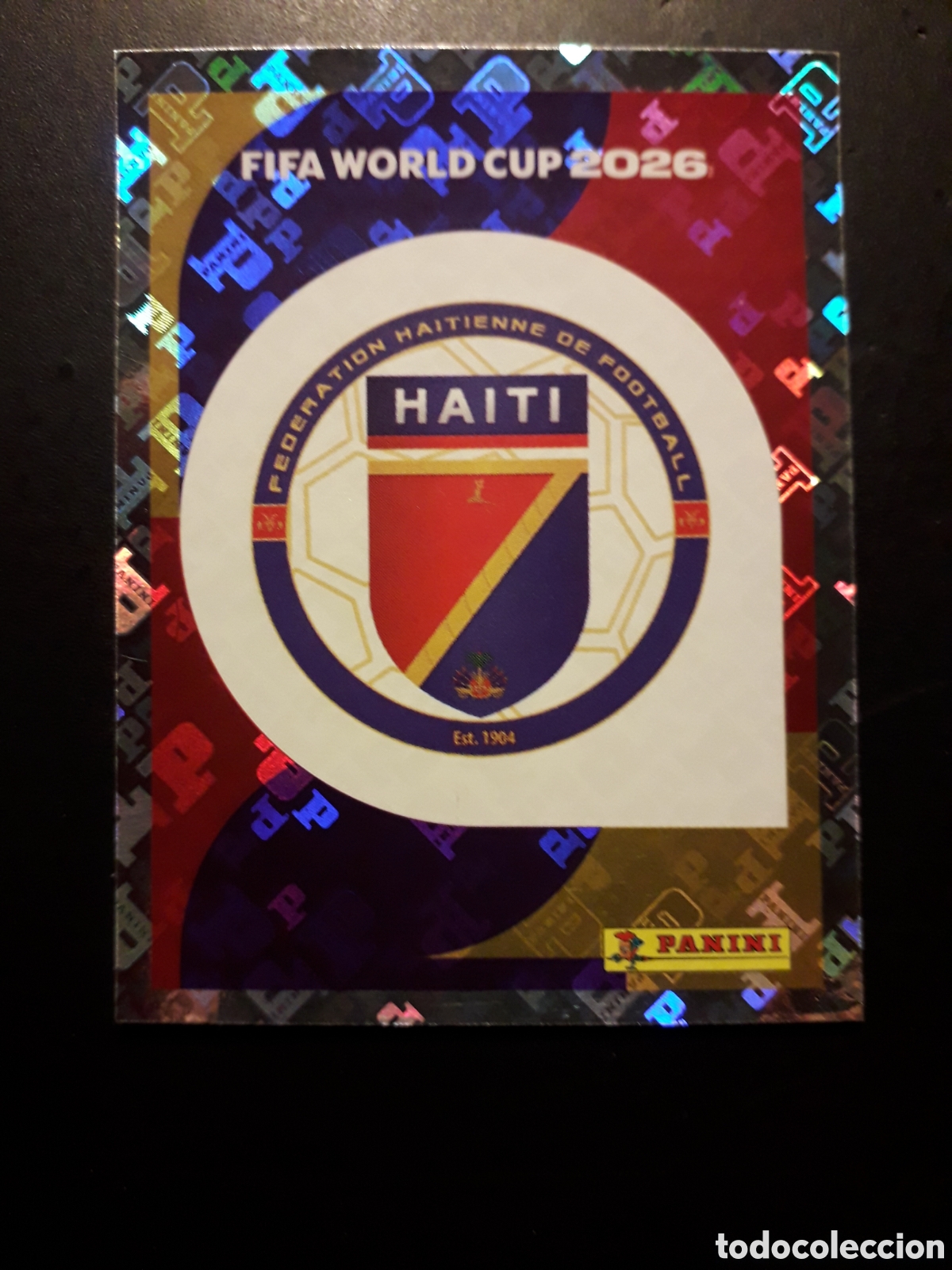 Cromos de F&uacute;tbol: ESCUDO HAIT&Iacute; HAI 1 MUNDIAL F&Uacute;TBOL 2026 FIFA WORLD CUP PANINI SIN PEGAR PEDIDO M&Iacute;NIMO 3&euro;