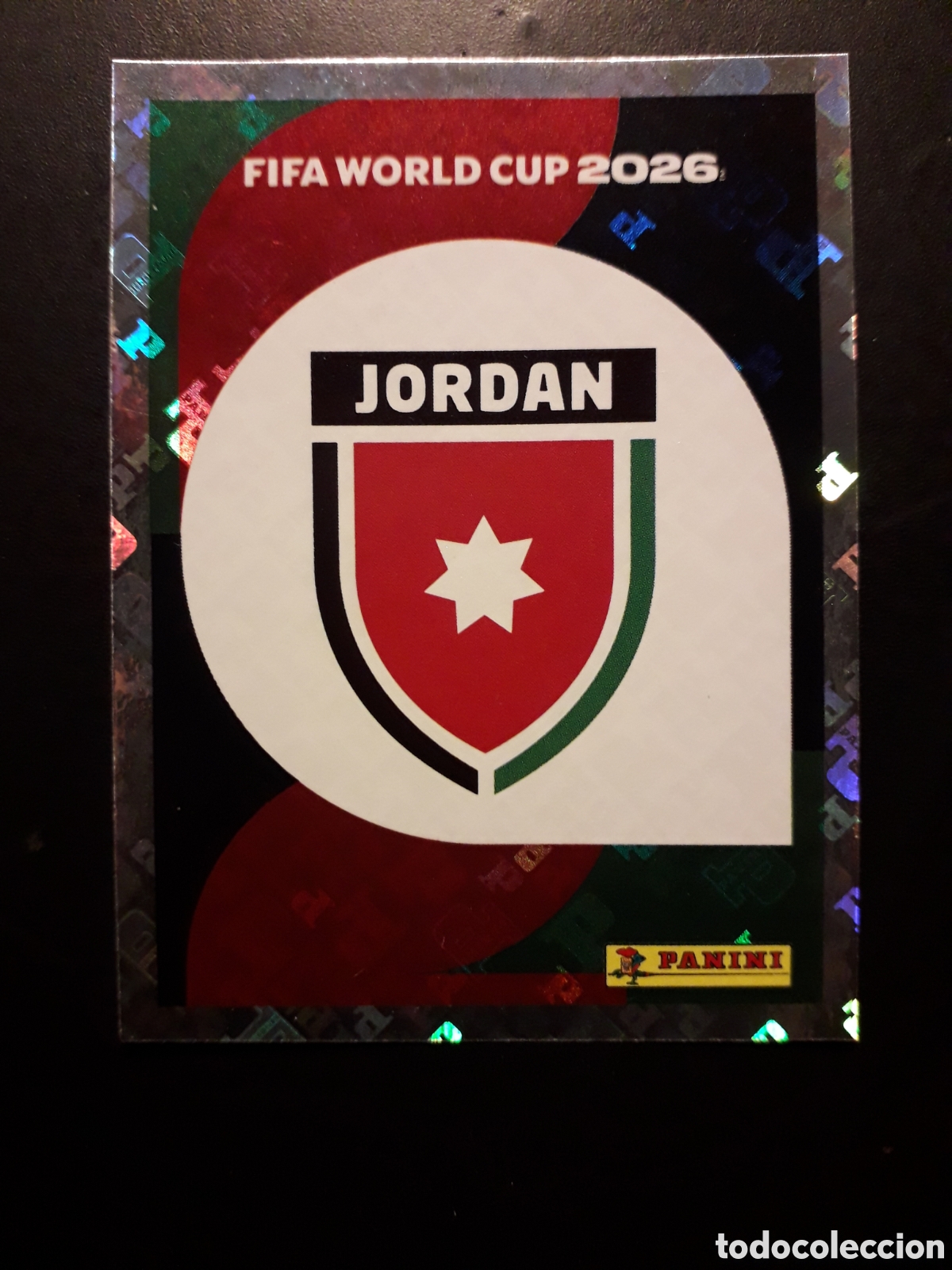Cromos de F&uacute;tbol: ESCUDO JORDANIA JOR 1 MUNDIAL F&Uacute;TBOL 2026 FIFA WORLD CUP PANINI SIN PEGAR PEDIDO M&Iacute;NIMO 3&euro;