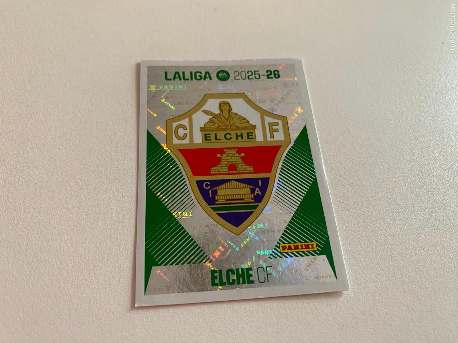 Cromos de F&uacute;tbol: LALIGA ESTE 2025 2026 EA SPORTS 25 26 ALBUM PANINI LIGA N 1 ELCHE CF ESCUDO