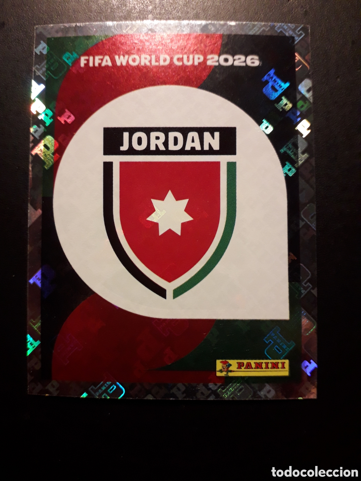 Cromos de F&uacute;tbol: ESCUDO JORDANIA JOR 1 MUNDIAL F&Uacute;TBOL 2026 FIFA WORLD CUP PANINI SIN PEGAR PEDIDO M&Iacute;NIMO 3&euro;