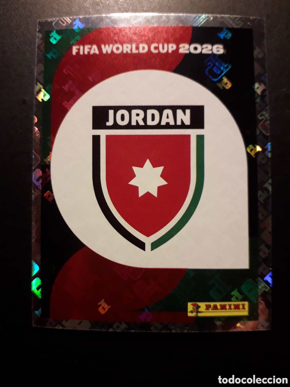 Cromos de F&uacute;tbol: ESCUDO JORDANIA JOR 1 MUNDIAL F&Uacute;TBOL 2026 FIFA WORLD CUP PANINI SIN PEGAR PEDIDO M&Iacute;NIMO 3&euro;