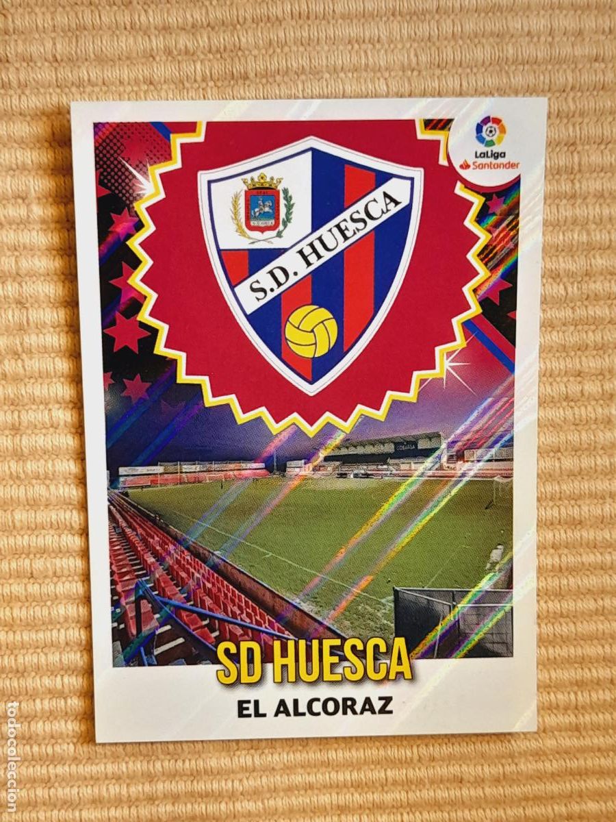 Cromos de F&uacute;tbol: CROMO 21 ESCUDO SD HUESCA LIGA 18-19 (2018 2019) ALBUM ESTE