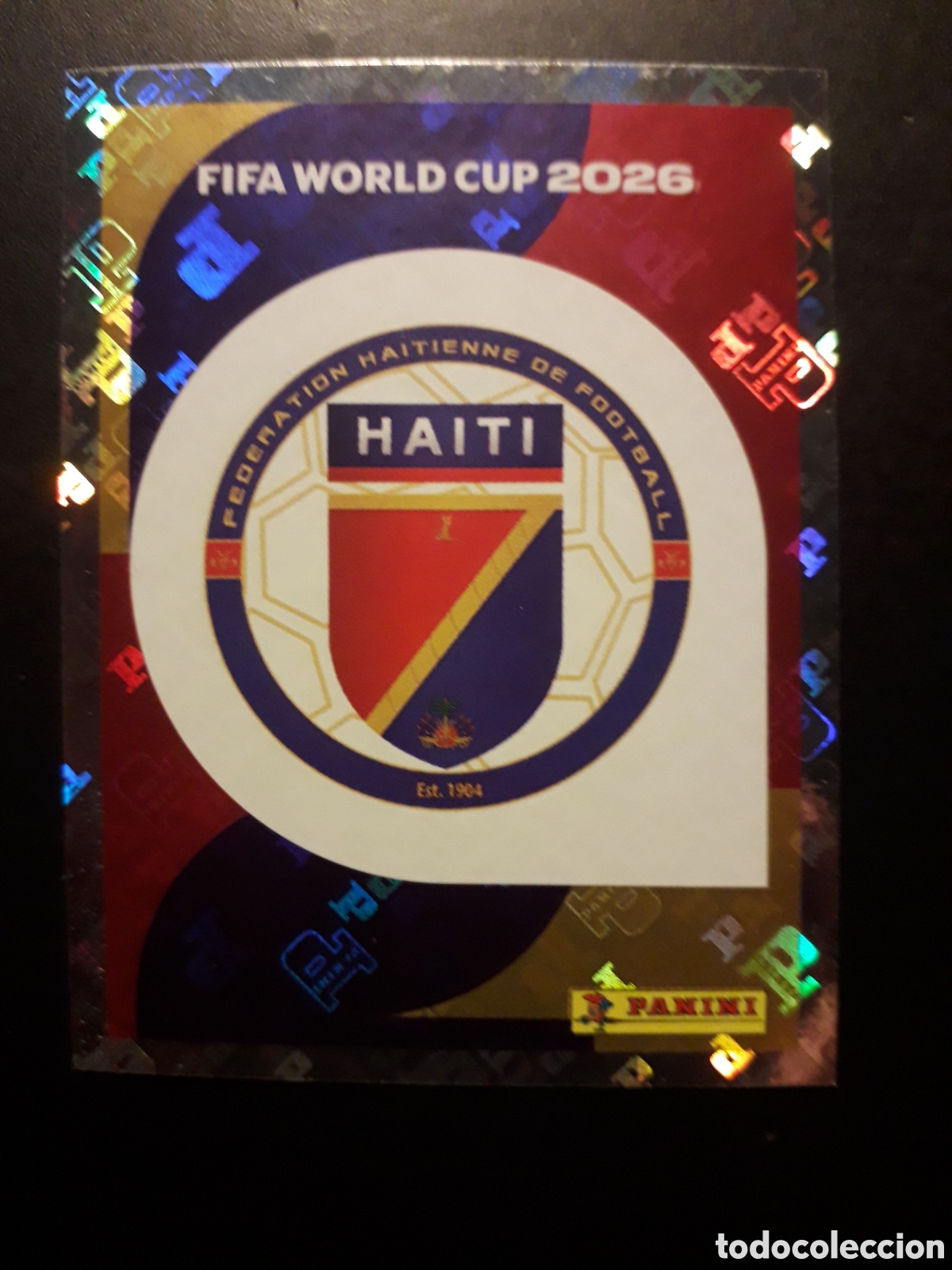 Cromos de F&uacute;tbol: ESCUDO HAIT&Iacute; HAI 1 MUNDIAL F&Uacute;TBOL 2026 FIFA WORLD CUP PANINI SIN PEGAR PEDIDO M&Iacute;NIMO 3&euro;