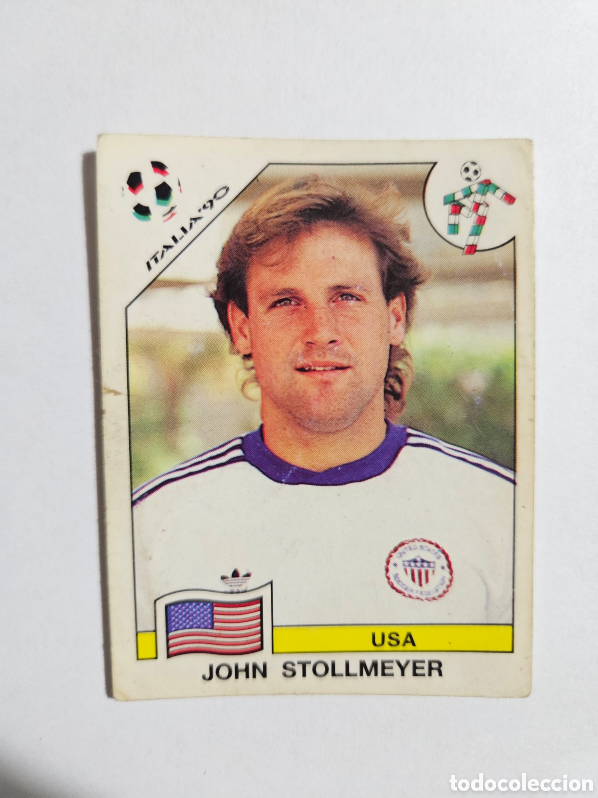 Cromos de F&uacute;tbol: N&deg;106 John Stollmeyer (USA) Mundial Italia 90 PANINI. Nunca pegado