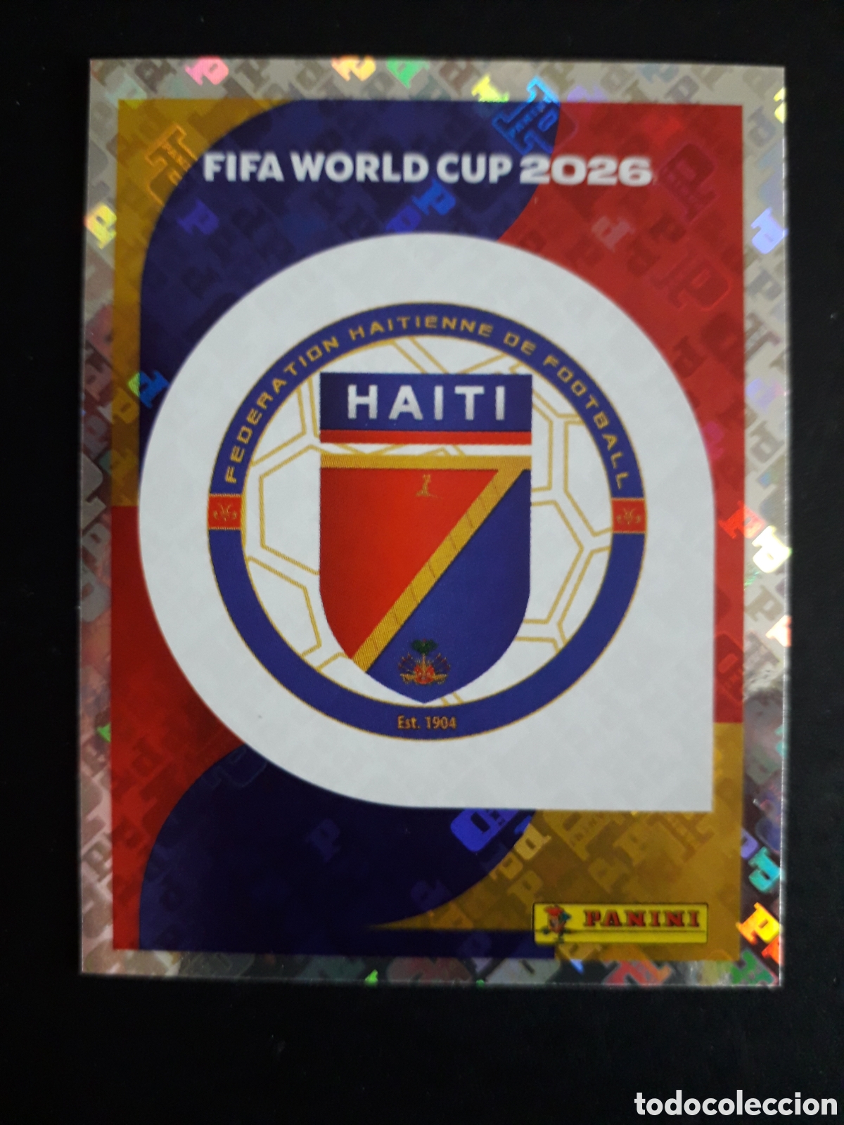 Cromos de F&uacute;tbol: ESCUDO HAIT&Iacute; HAI 1 MUNDIAL F&Uacute;TBOL 2026 FIFA WORLD CUP PANINI SIN PEGAR PEDIDO M&Iacute;NIMO 3&euro;