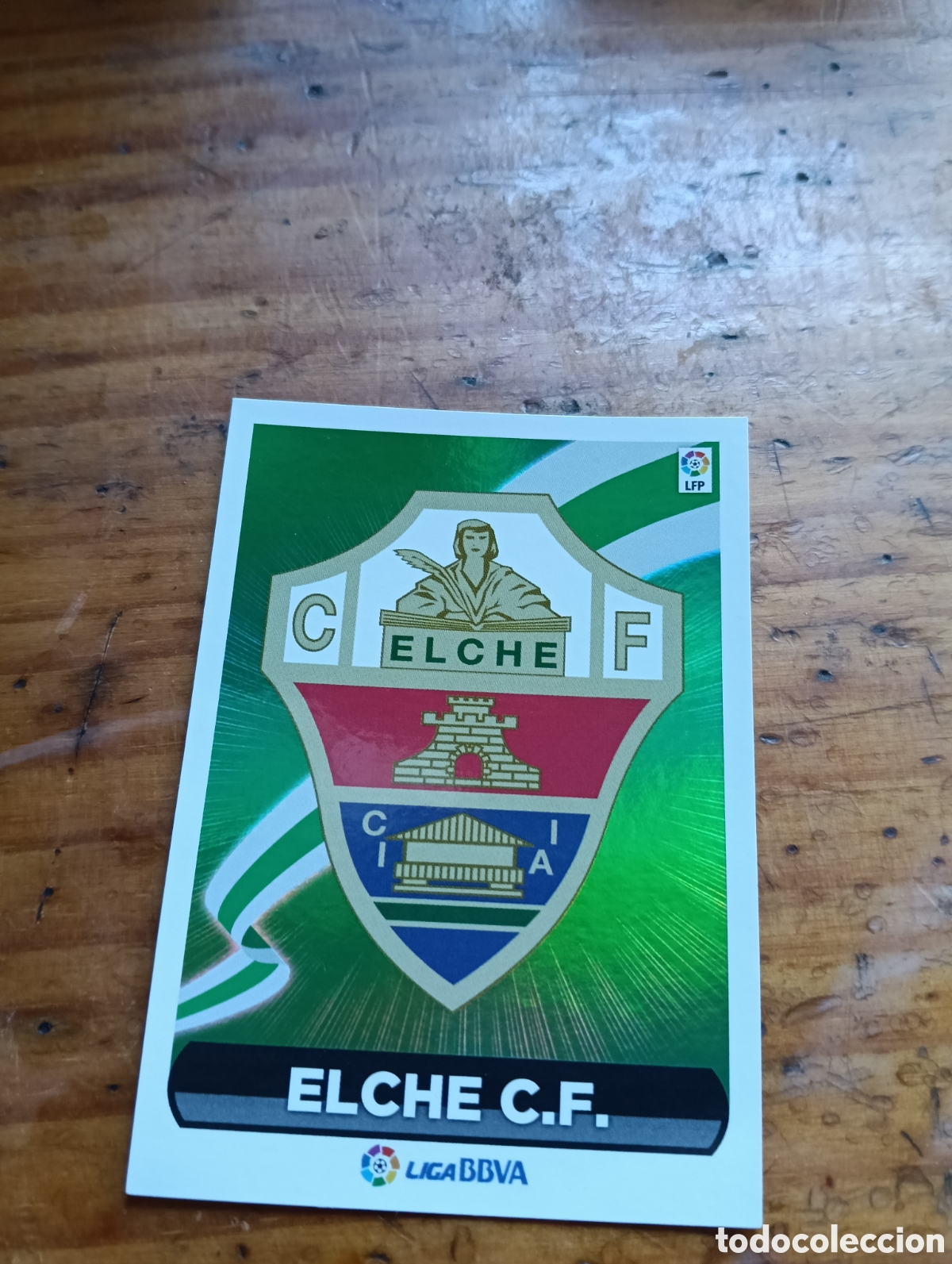 Cromos de F&uacute;tbol: Cromo N&deg;23 Escudo (Elche C.F) LaLiga Este 2014-15 Panini