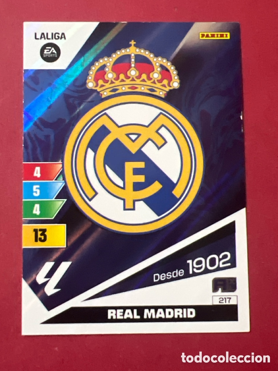 Figurine di Calcio: C7063. 217 Escudo Real Madrid ADRENALYN XL 2023/24