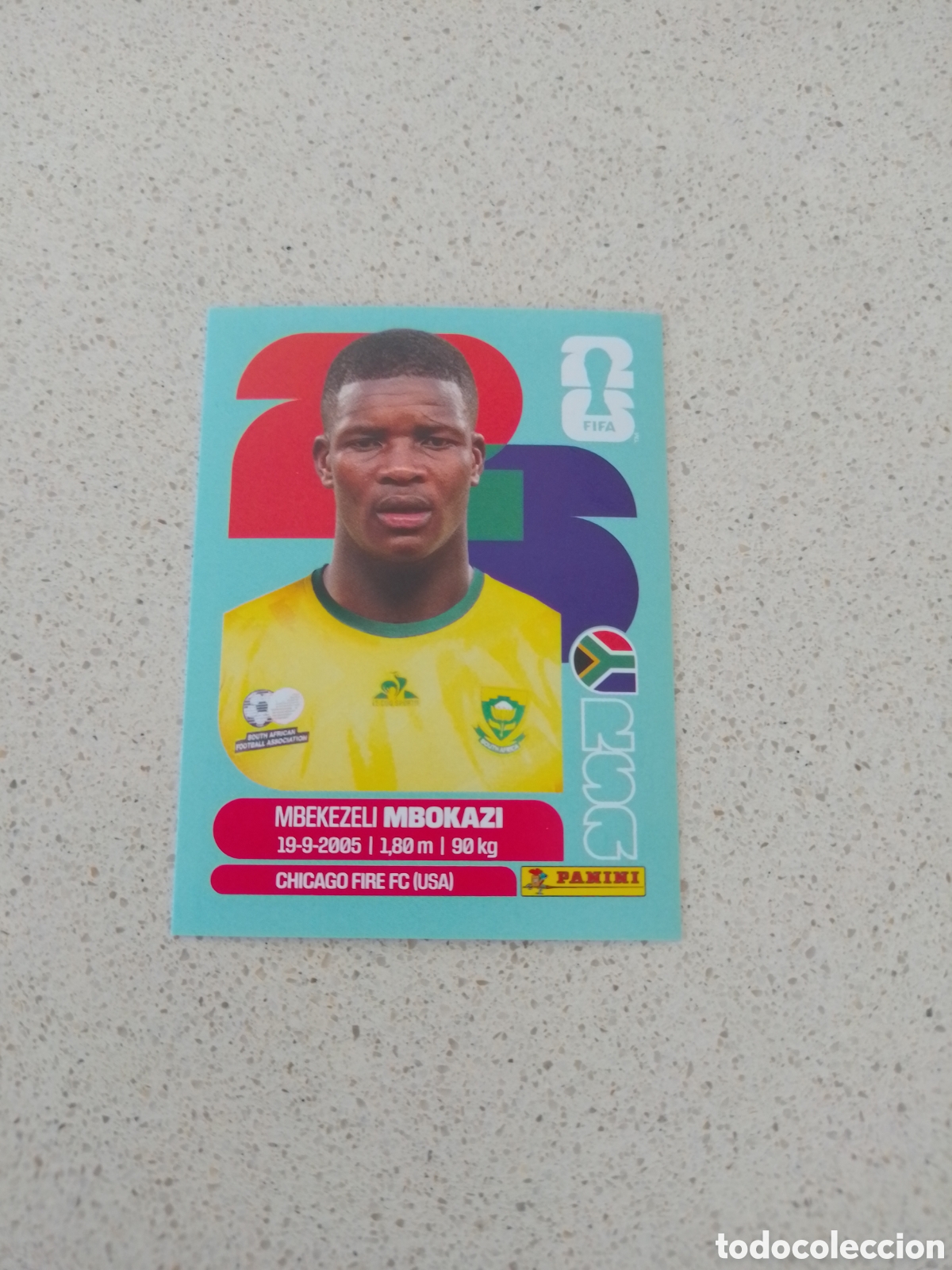 Cromos de F&uacute;tbol: CROMO NUMERO 6 MBOKAZI SUDAFRICA. MUNDIAL 2026. PANINI.