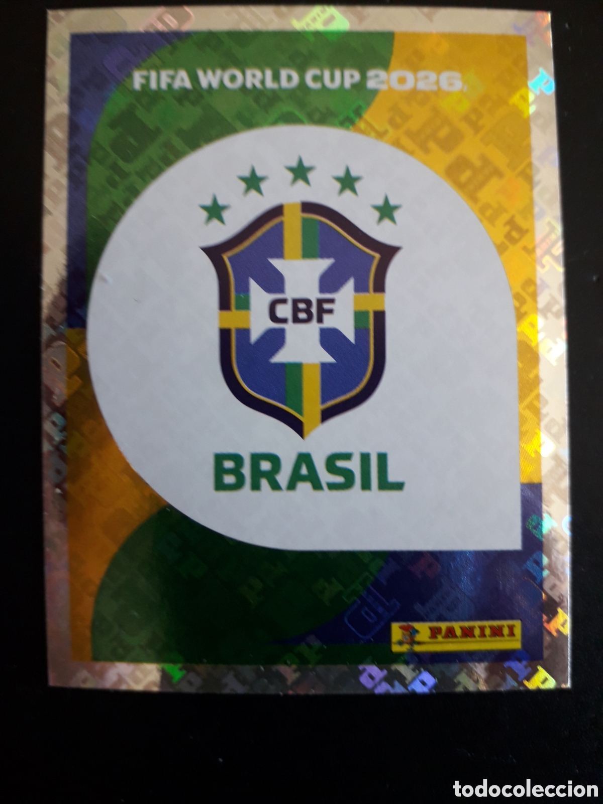 Cromos de F&uacute;tbol: ESCUDO BRASIL BRA 1 MUNDIAL F&Uacute;TBOL 2026 FIFA WORLD CUP PANINI SIN PEGAR PEDIDO M&Iacute;NIMO 3&euro;.