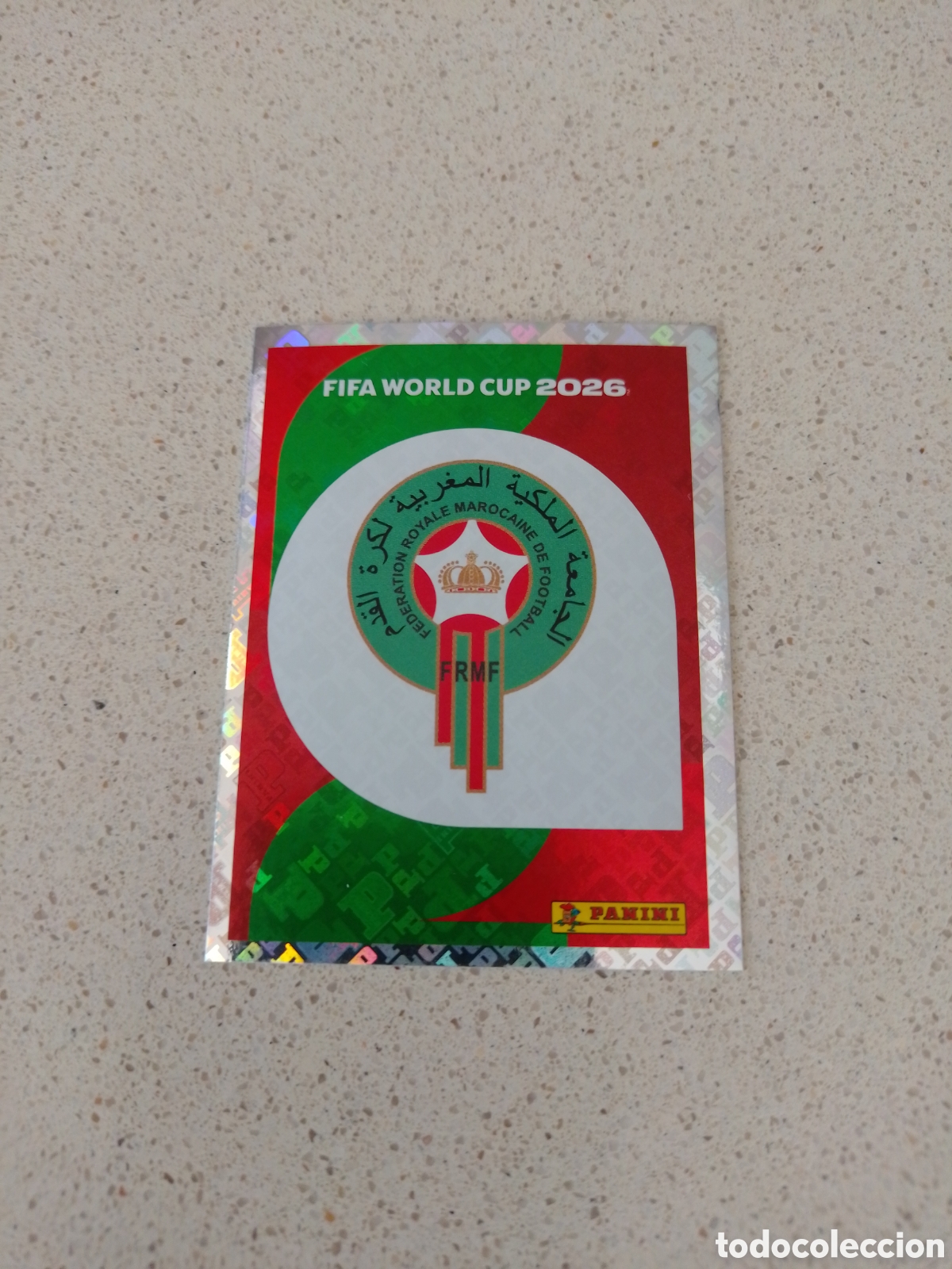 Figurine di Calcio: CROMO NUMERO 1 ESCUDO MARRUECOS. MUNDIAL 2026. PANINI.