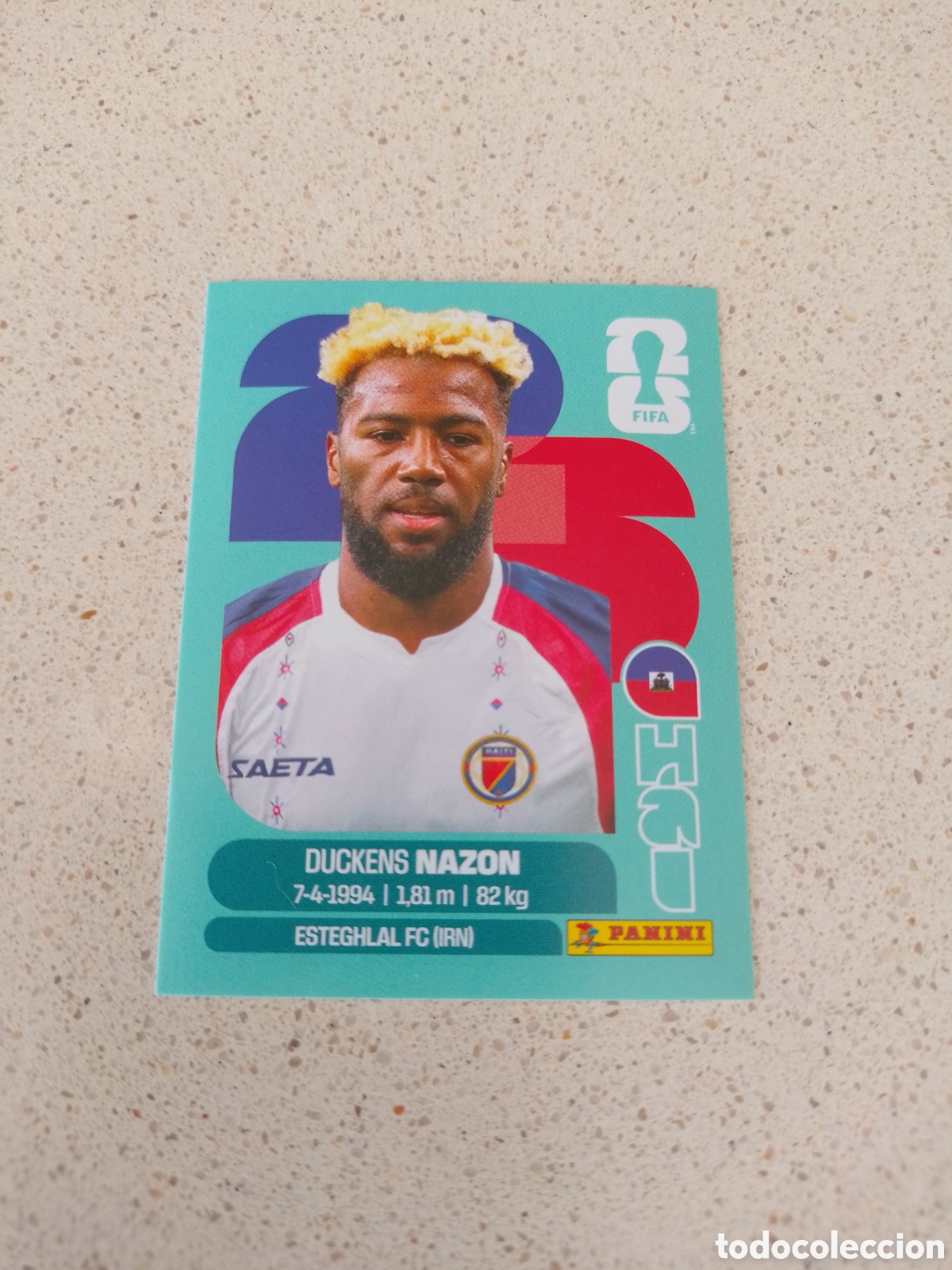 Fu&szlig;ball-Sticker: CROMO NUMERO 18 NAZON HAITI. MUNDIAL 2026. PANINI.
