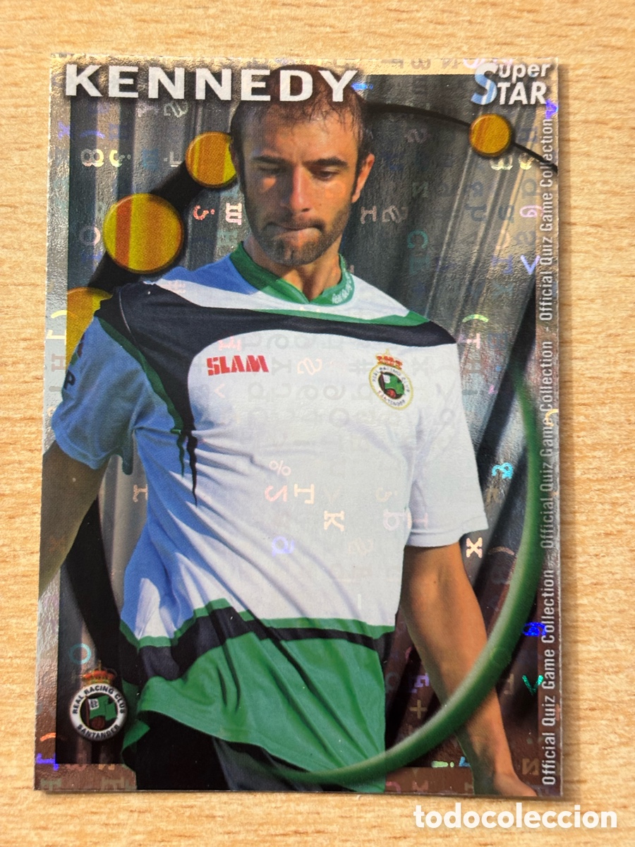 Cromos de F&uacute;tbol: # 432 Kennedy Racing de Santander Superstar Mundicromo 2011 fondo letras