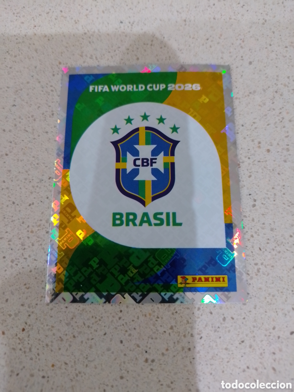 Figurine di Calcio: CROMO NUMERO 1 ESCUDO BRASIL. MUNDIAL 2026. PANINI.