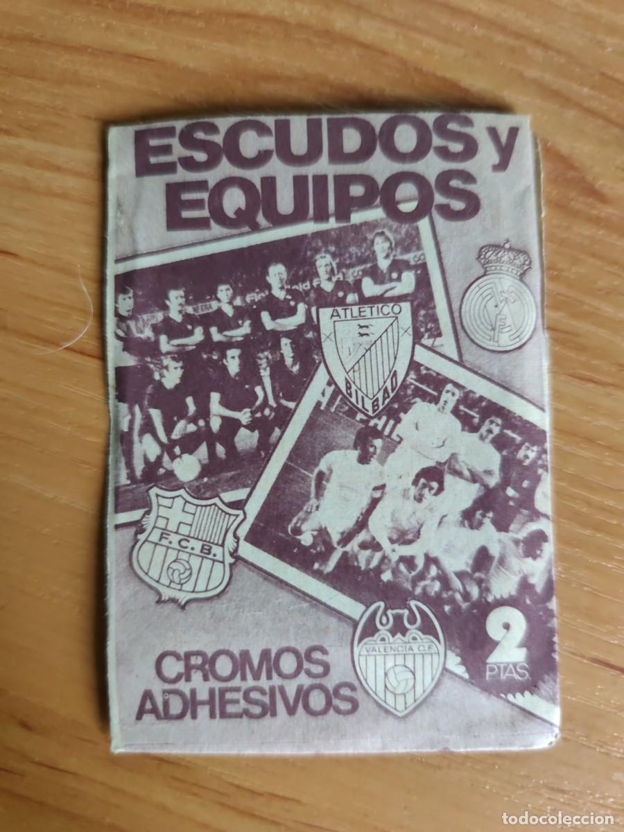 Football Stickers: Sobre sin abrir ESCUDOS Y EQUIPOS Este 75 76