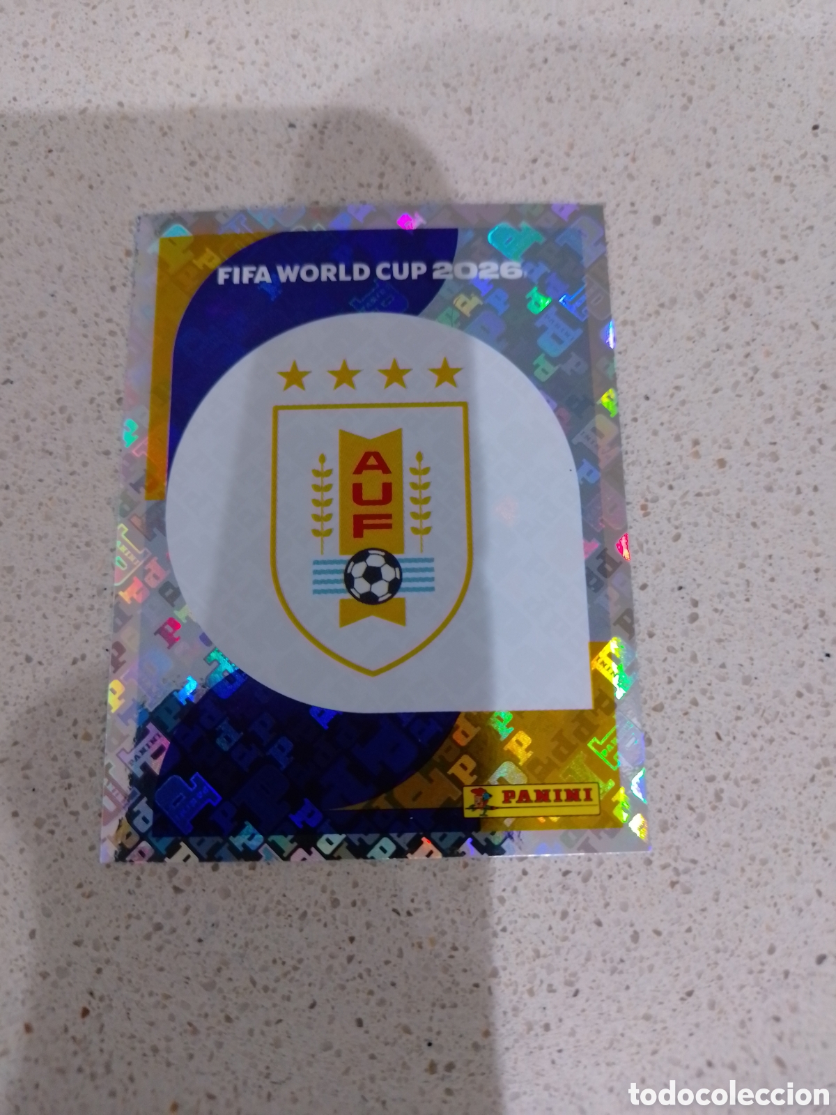 Cromos de f&uacute;tbol: CROMO NUMERO 1 ESCUDO URUGUAY. MUNDIAL 2026. PANINI.