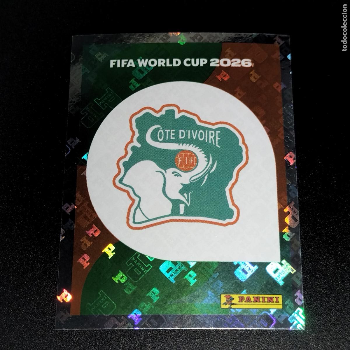 Figurine di Calcio: CIV 1 ESCUDO LOGO COSTA DE MARFIL CROMOS STICKER MUNDIAL 26 2026 FIFA WORLD CUP PANINI
