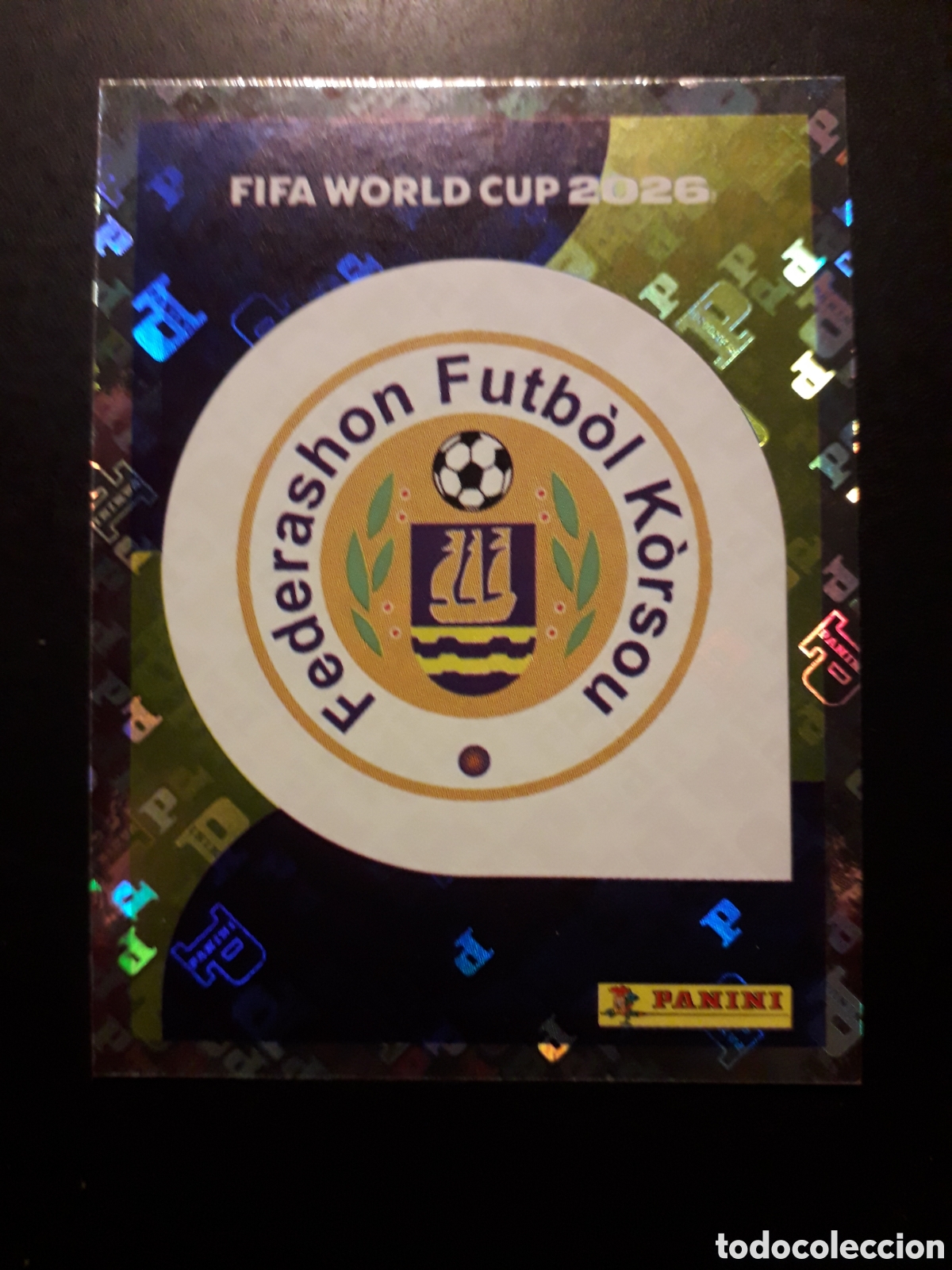 Cromos de f&uacute;tbol: ESCUDO CURA&Ccedil;AO CUW 1 MUNDIAL F&Uacute;TBOL 2026 FIFA WORLD CUP PANINI SIN PEGAR PEDIDO M&Iacute;NIMO 3&euro;