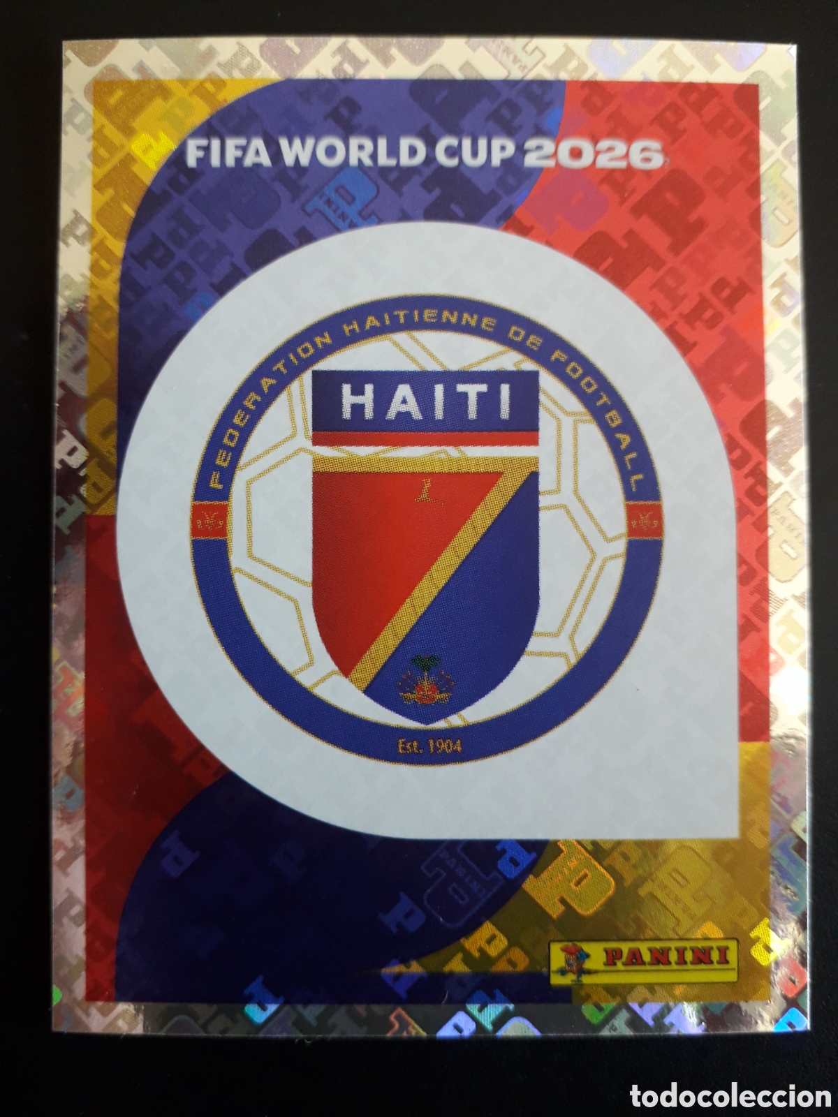 Cromos de f&uacute;tbol: ESCUDO HAIT&Iacute; HAI 1 MUNDIAL F&Uacute;TBOL 2026 FIFA WORLD CUP PANINI SIN PEGAR PEDIDO M&Iacute;NIMO 3&euro;