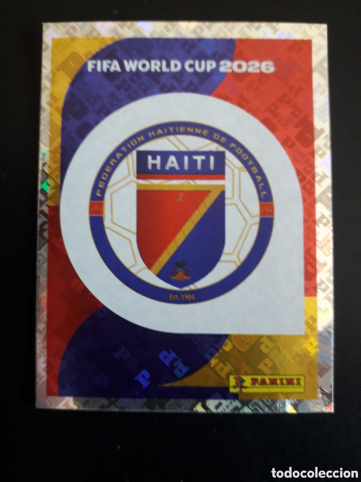 Cromos de Futebol: ESCUDO HAIT&Iacute; HAI 1 MUNDIAL F&Uacute;TBOL 2026 FIFA WORLD CUP PANINI SIN PEGAR PEDIDO M&Iacute;NIMO 3&euro;.