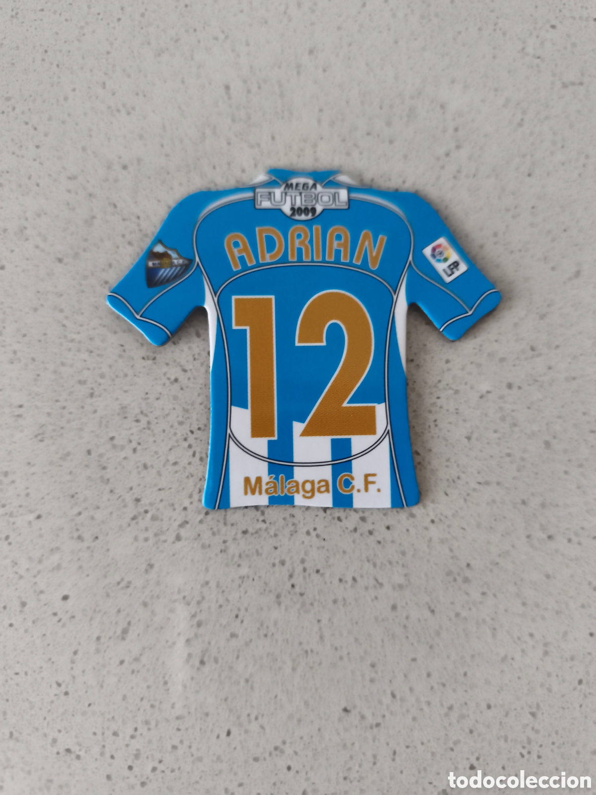 Cromos de f&uacute;tbol: CAMISETA IMAN NUMERO 12 ADRIAN MALAGA. MEGA FUTBOL MAGNETS 2008-2009