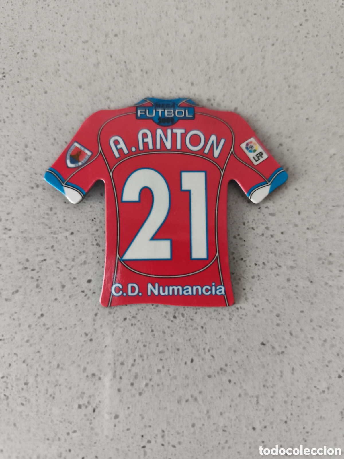 Cromos de f&uacute;tbol: CAMISETA IMAN NUMERO 21 ANTON NUMANCIA. MEGA FUTBOL MAGNETS 2008-2009