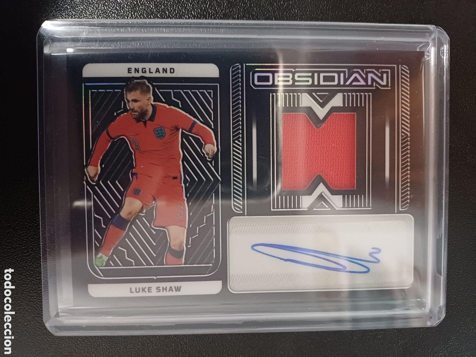 Cromos de f&uacute;tbol: #JA-LSH LUKE SHAW MANCHESTER UNITED 063/182 AUTOGRAFO ORIGINAL RELIC PANINI OBSIDIAN 2022-23