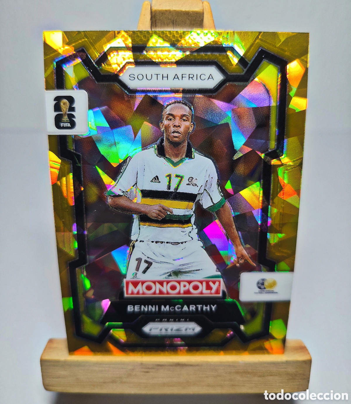 Cromos de f&uacute;tbol: BENNI McCARTHY 2026 SUD&Aacute;FRICA GOLD CRACKED ICE MONOPOLY PRIZM PANINI.
