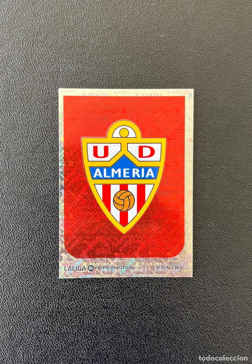 Cromos de f&uacute;tbol: 21 ESCUDO UD ALMER&Iacute;A LA LIGA HYPERMOTION 2025 2026 PANINI 25 26