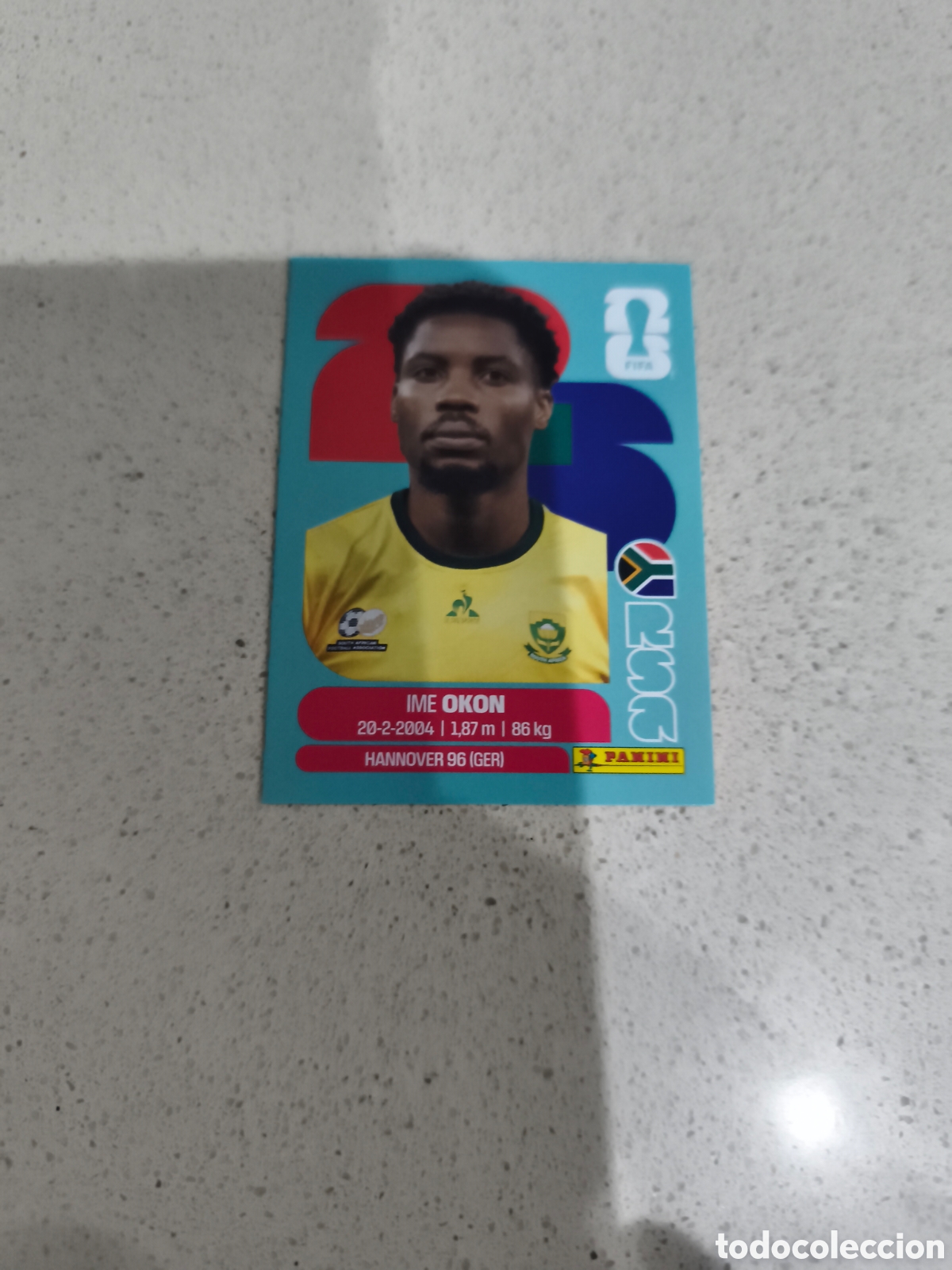 Fu&szlig;ball-Sticker: CROMO OKON SUDAFRICA. SET ACTUALIZACI&Oacute;N MUNDIAL 2026. PANINI.