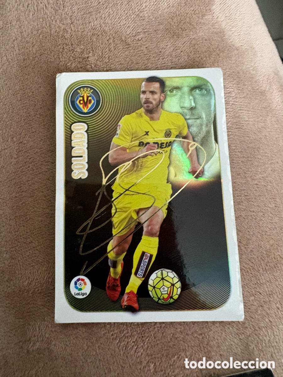 Football Stickers: LIGA SANTANDER - 2016 2017 (16 17) - SERIE ORO N&ordm; 16 SOLDADO (VILLARREAL C.F.) - LOGO ANTIGUO - COLE