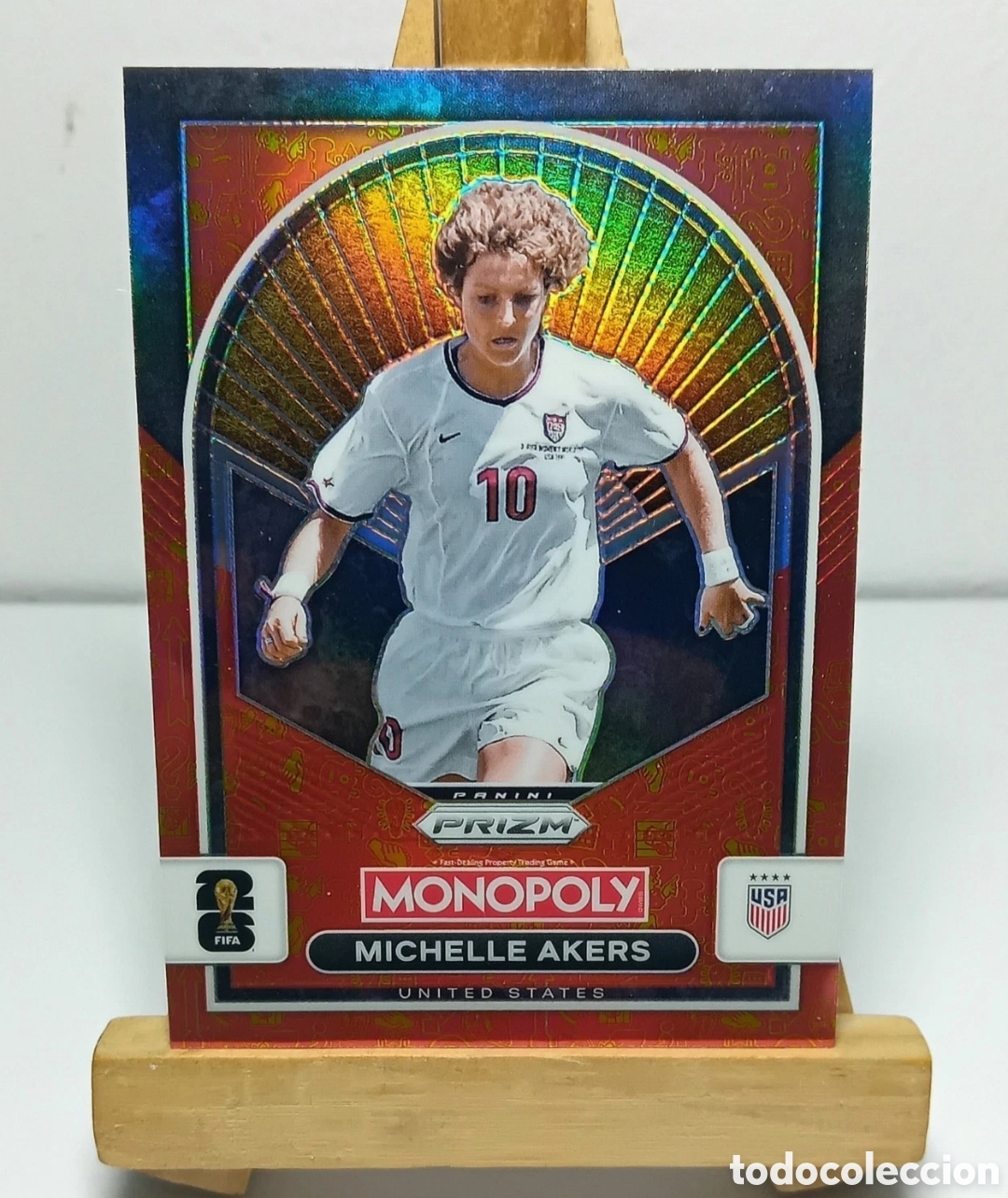 Cromos de f&uacute;tbol: MICHELLE AKERS 2026 USA ORANGE & GOLD CLASSIC ICONS MONOPOLY PRIZM PANINI.