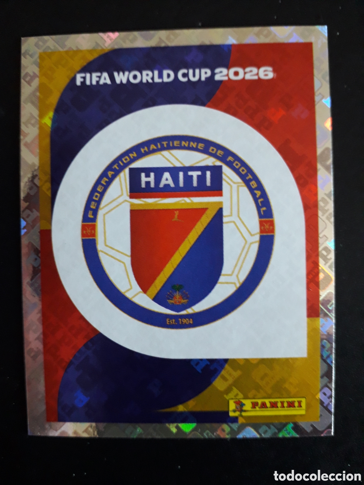 Cromos de f&uacute;tbol: ESCUDO HAIT&Iacute; HAI 1 MUNDIAL F&Uacute;TBOL 2026 FIFA WORLD CUP PANINI SIN PEGAR PEDIDO M&Iacute;NIMO 3&euro;