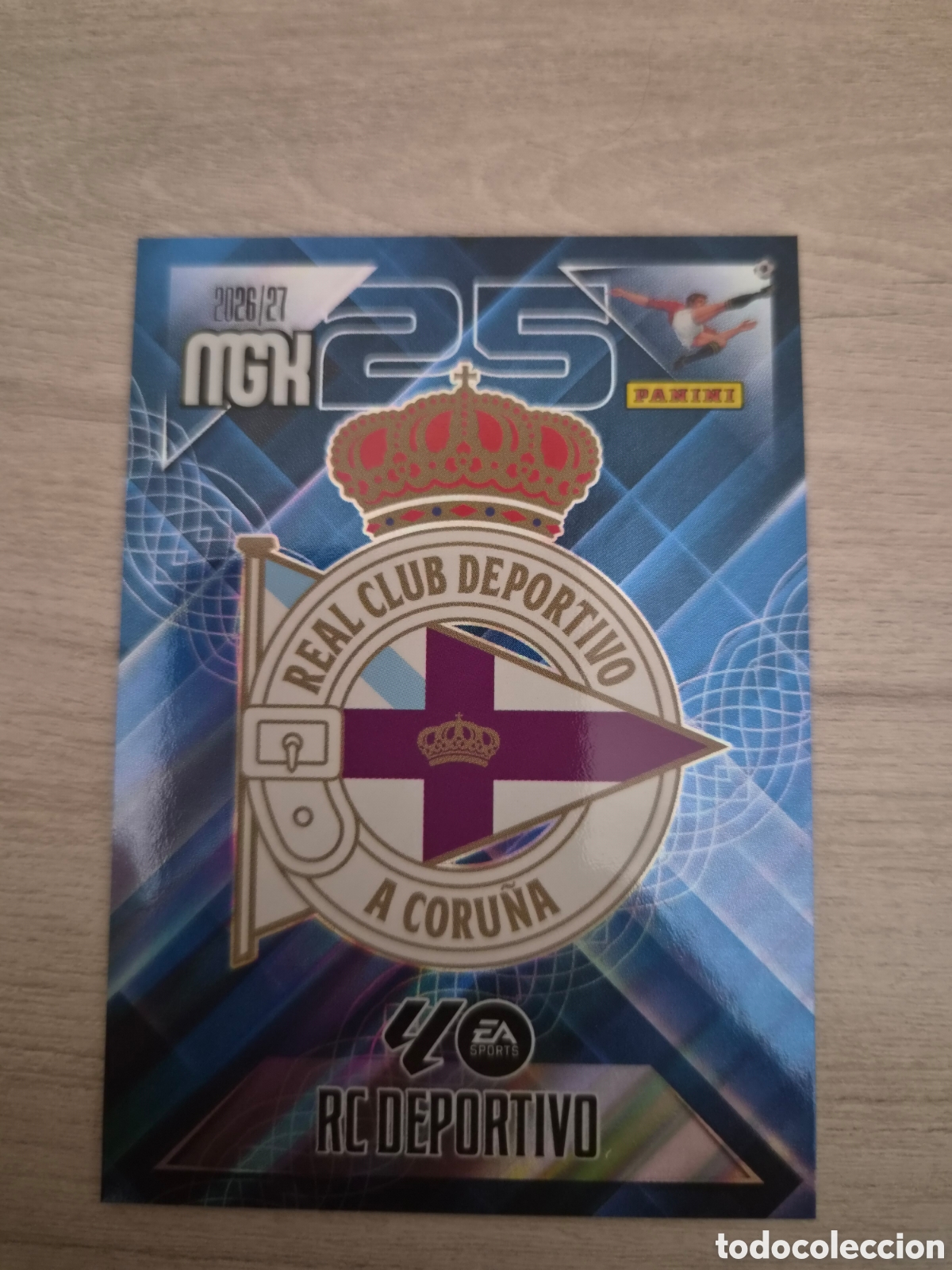 Cromos de f&uacute;tbol: N&deg;127 Escudo Deportivo A Coru&ntilde;a Megacracks 26/27