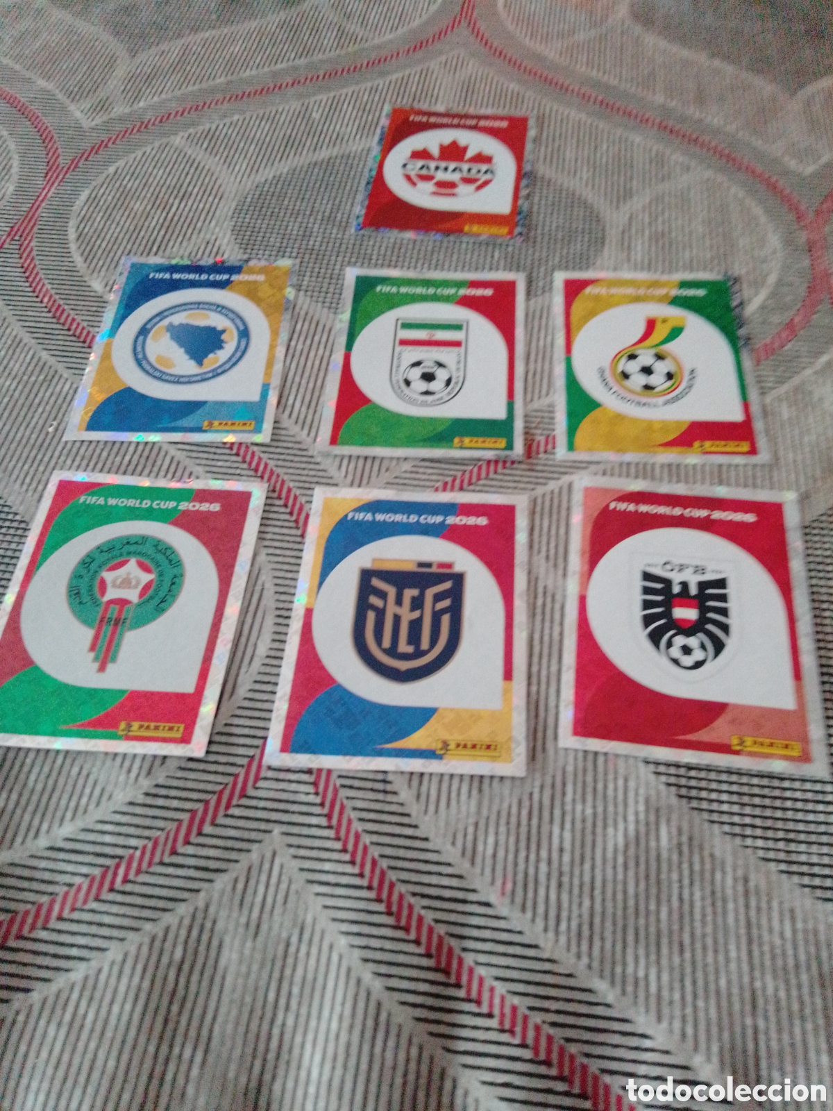 Cromos de f&uacute;tbol: LOTE GANGA 7 ESCUDOS MUNDIAL 2026 PANINI SIN PEGAR