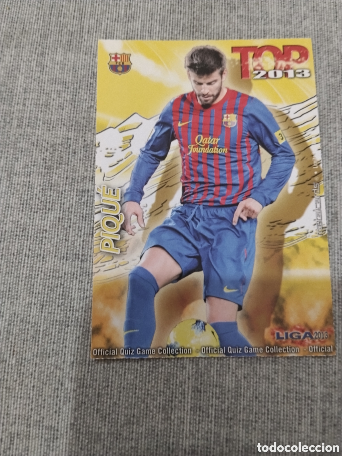 Cromos de f&uacute;tbol: MUNDICROMO QUIZ GAME 2013 (2012 13) N&ordm; 569 PIQUE - FC BARCELONA (TOP AMARILLO / DORADO MATE)