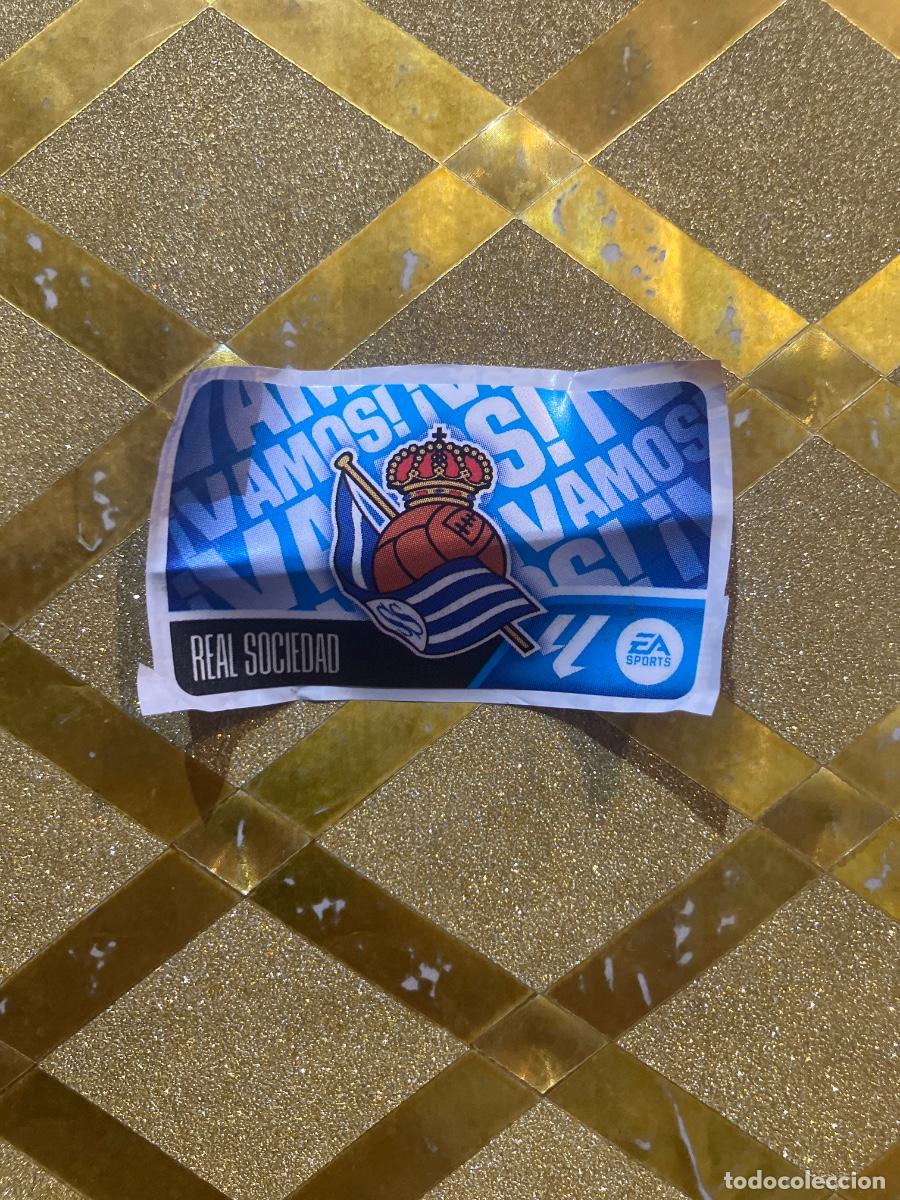 Cartes &agrave; collectionner de Football: CROMO DE FUTBOL ESCUDO REAL SOCIEDAD &iexcl;VAMOS ! CHICLE LIGA 2026 2027 PANINI !