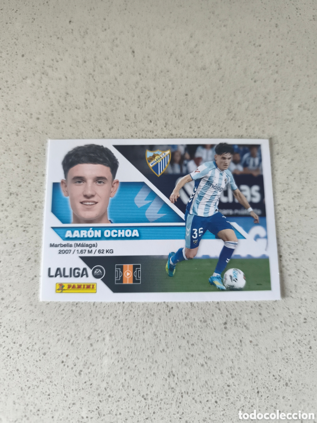 Cromos de f&uacute;tbol: CROMO N&Uacute;MERO 15 AARON OCHOA MALAGA. LIGA ESTE 26/27. PANINI.
